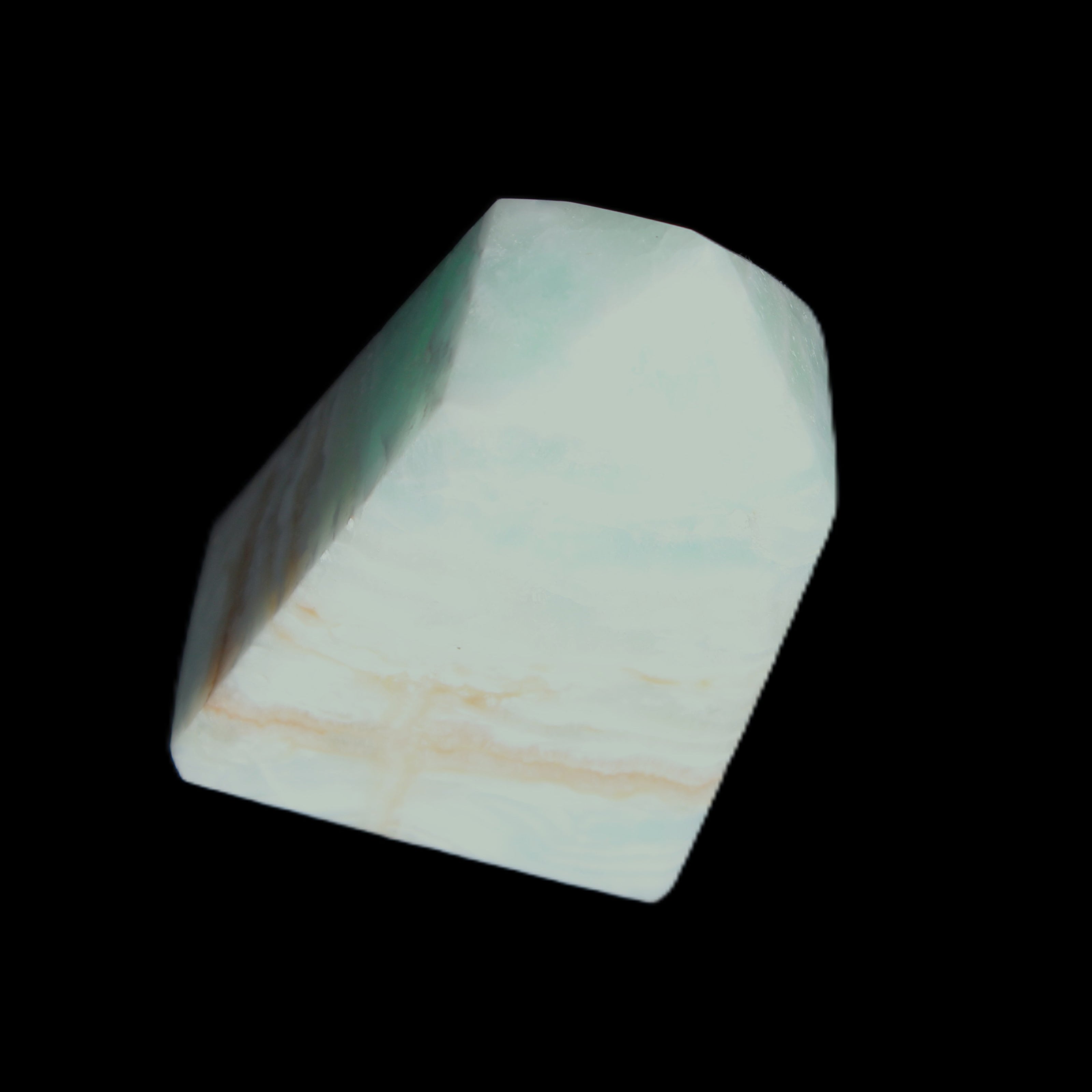 Pistachio Calcite obelisk 51*35*24mm 77g in sunlight - Rocks and Things Store