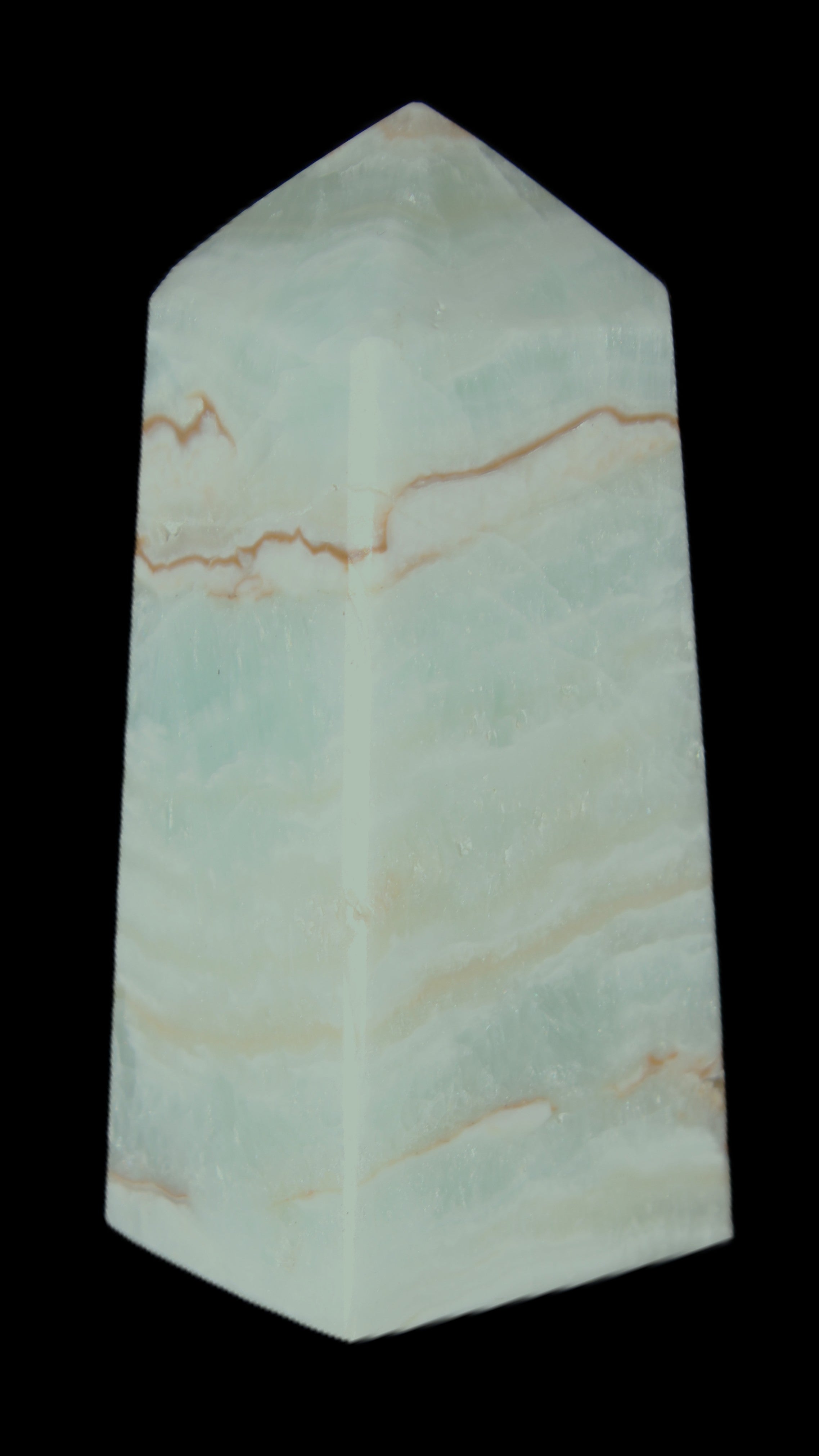 Pistachio Calcite obelisk 75*35*28mm 142g in sunlight - Rocks and Things Store