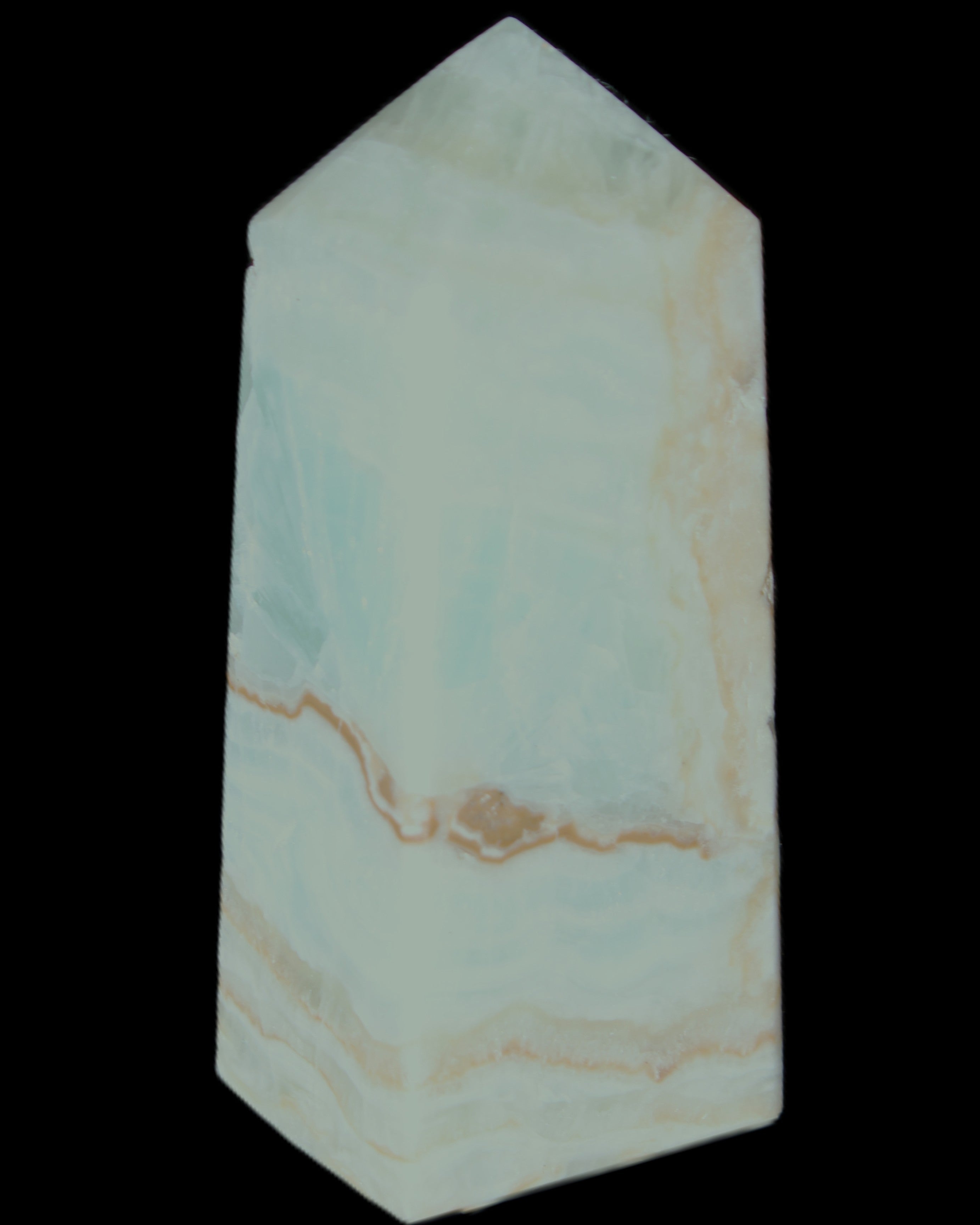 Pistachio Calcite obelisk 68*28*24mm 92g in sunlight - Rocks and Things Store