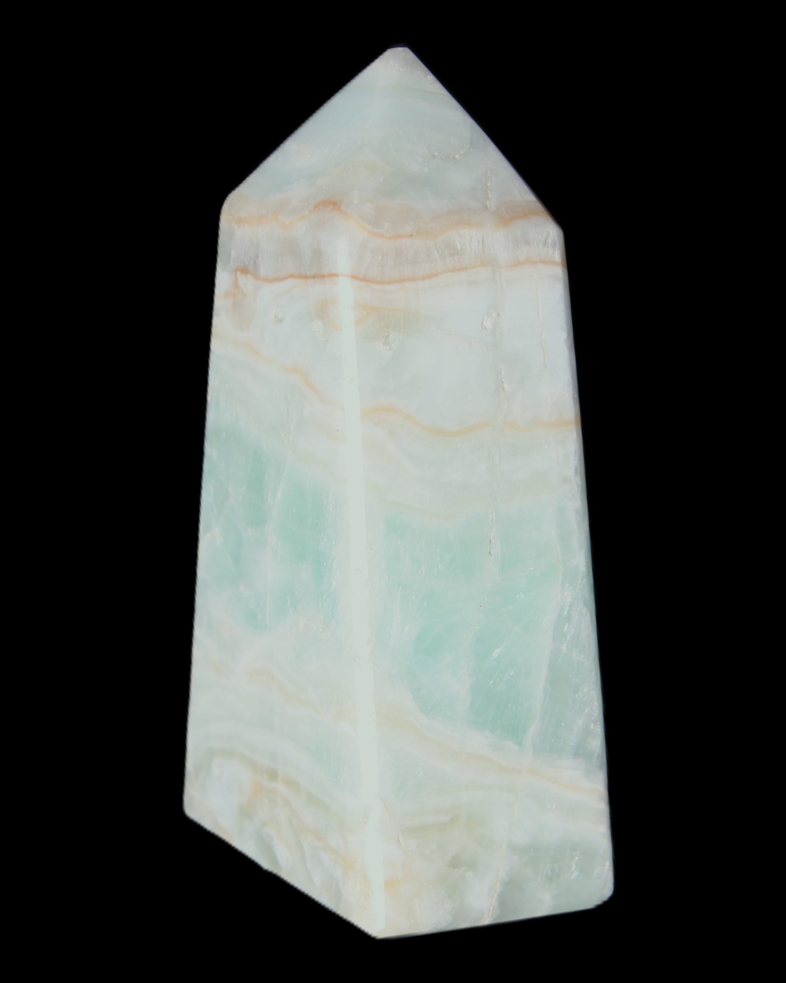 Pistachio Calcite obelisk 72*35*24mm 110g in sunlight - Rocks and Things Store