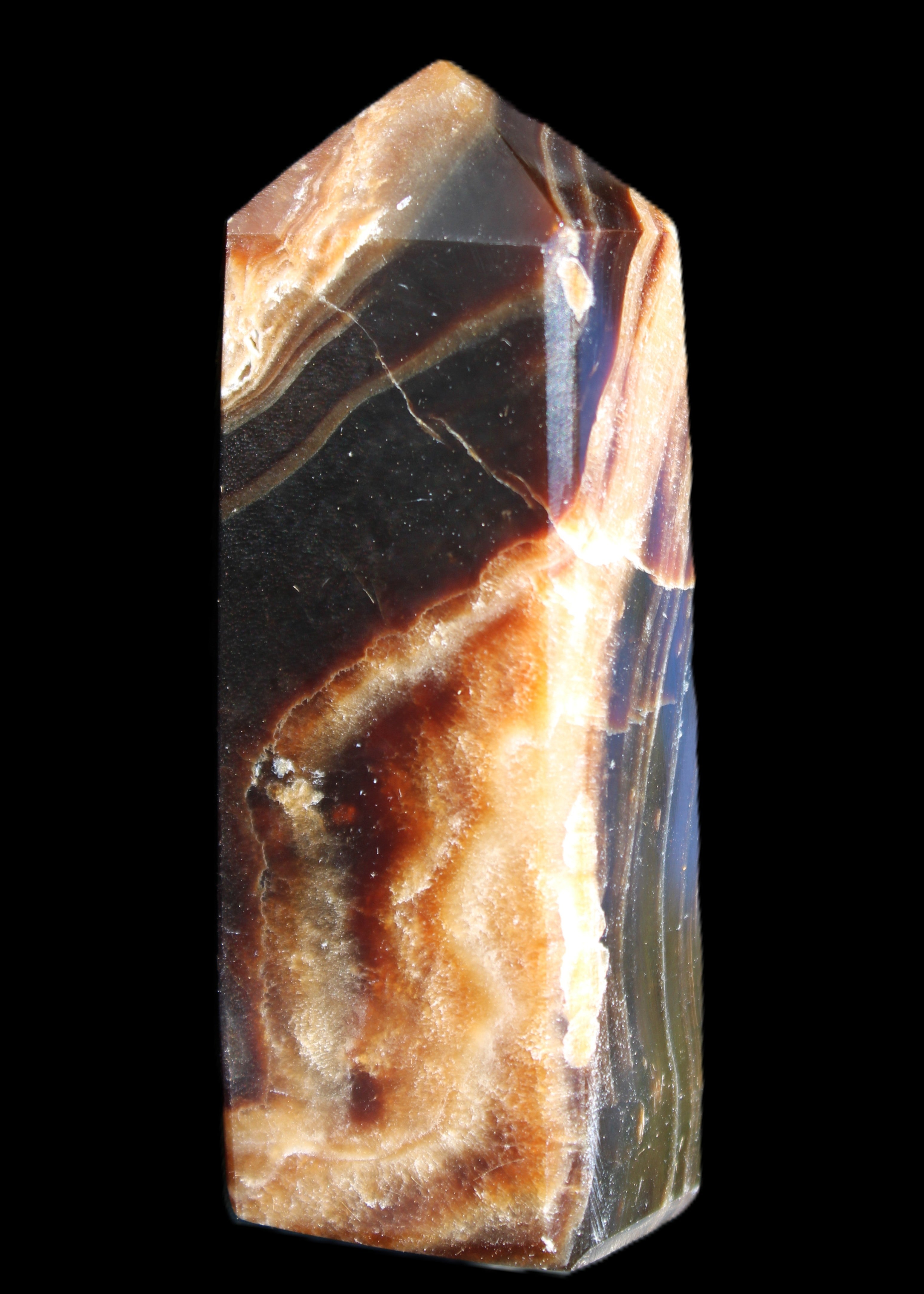 Chocolate Calcite obelisk 95*31*23mm 172g in sunlight - Rocks and Things Store