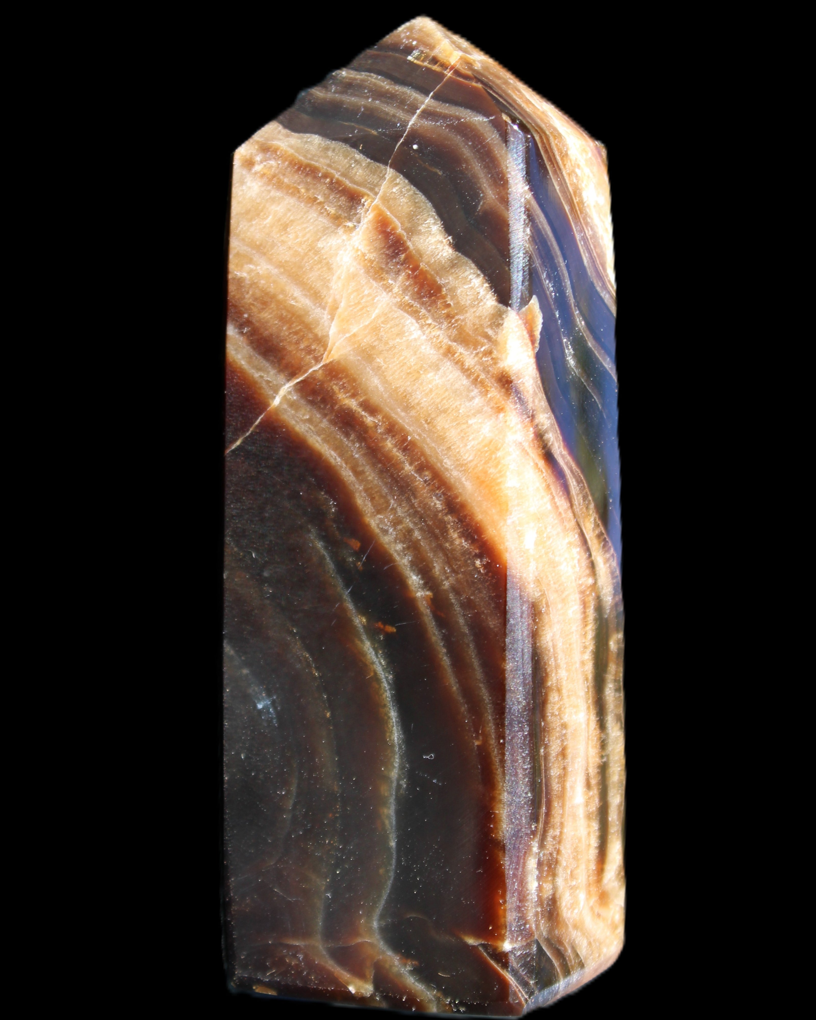 Chocolate Calcite obelisk 95*31*23mm 172g in sunlight - Rocks and Things Store
