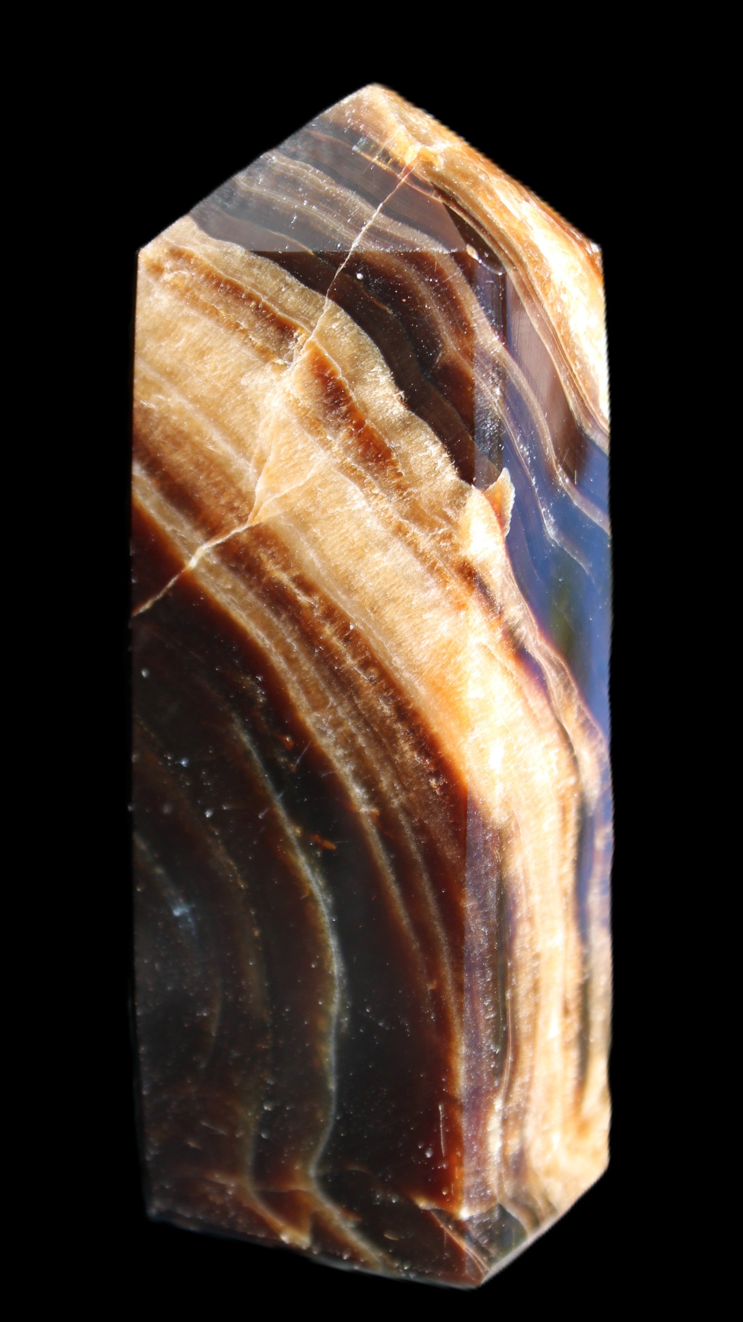 Chocolate Calcite obelisk 95*31*23mm 172g in sunlight - Rocks and Things Store