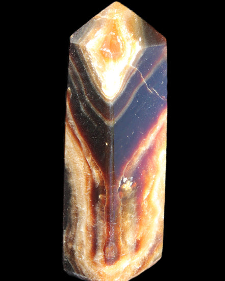 Chocolate Calcite obelisk 95*31*23mm 172g in sunlight - Rocks and Things Store