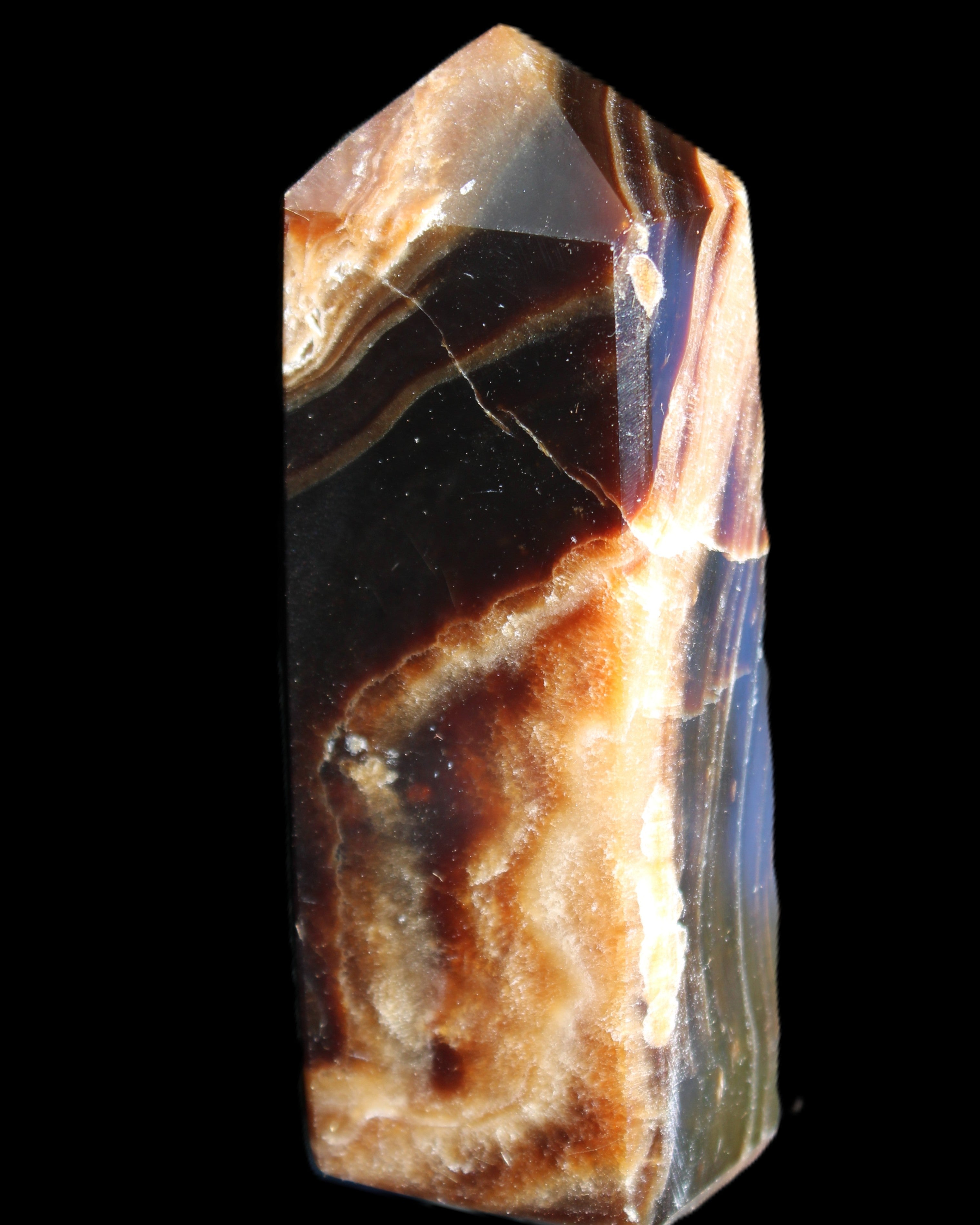 Chocolate Calcite obelisk 95*31*23mm 172g in sunlight - Rocks and Things Store