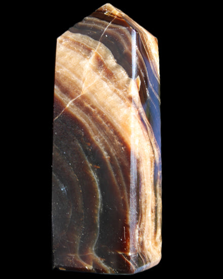 Chocolate Calcite obelisk 95*31*23mm 172g in sunlight - Rocks and Things Store