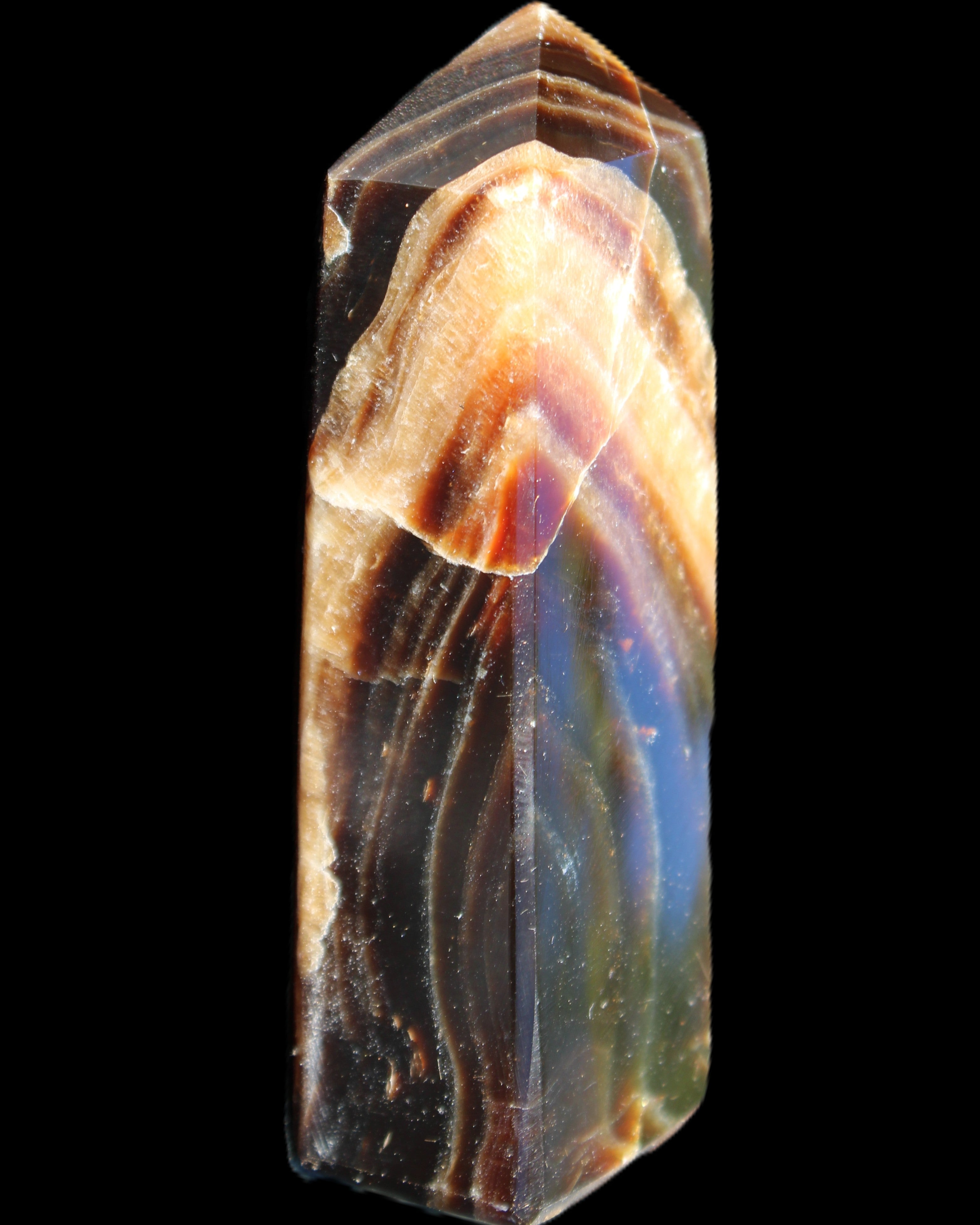 Chocolate Calcite obelisk 95*31*23mm 172g in sunlight - Rocks and Things Store