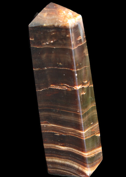 Chocolate Calcite obelisk 110*30*24mm 214g in sunlight - Rocks and Things Store