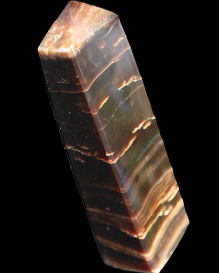 Chocolate Calcite obelisk 110*30*24mm 214g in sunlight - Rocks and Things Store