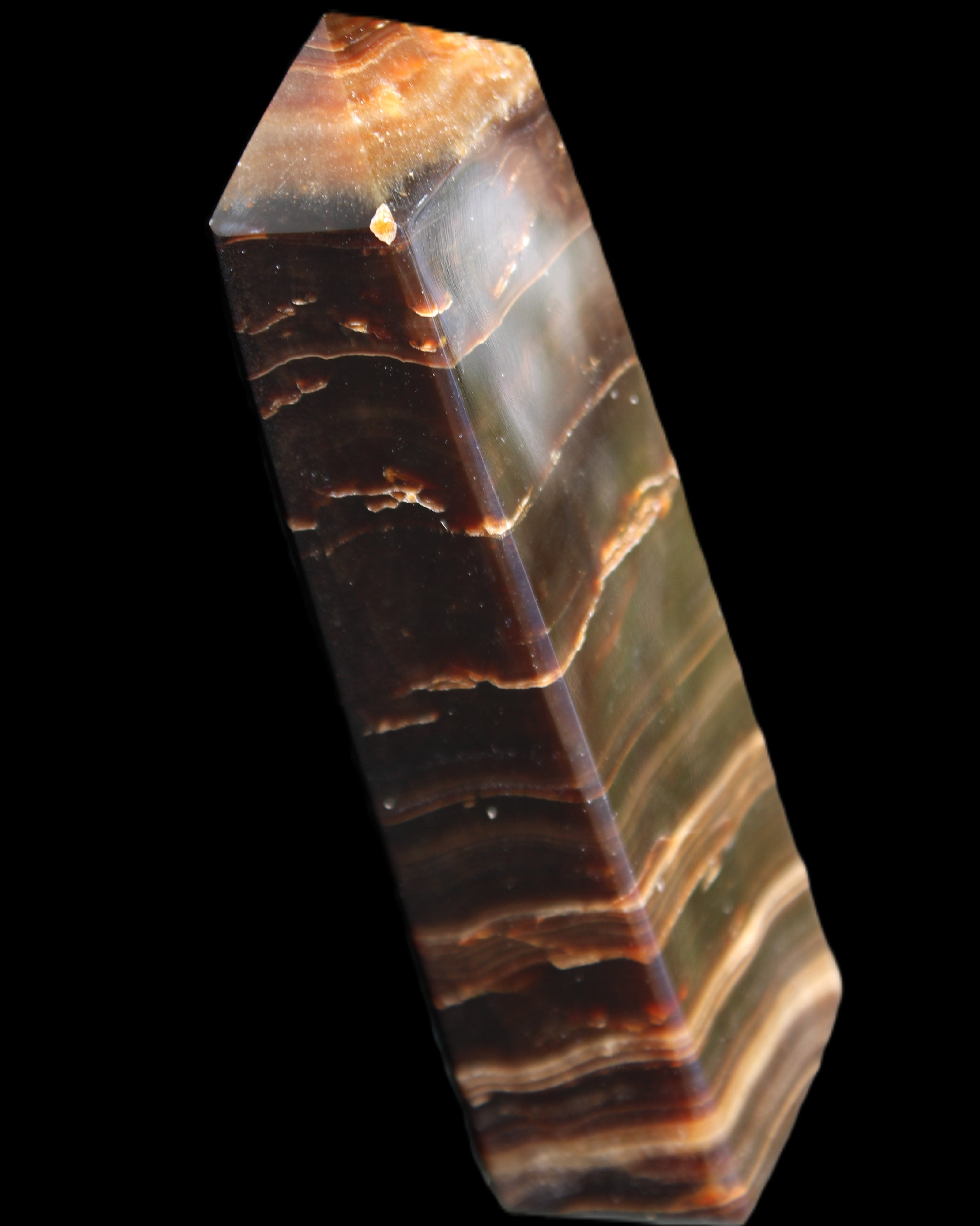 Chocolate Calcite obelisk 110*30*24mm 214g in sunlight - Rocks and Things Store