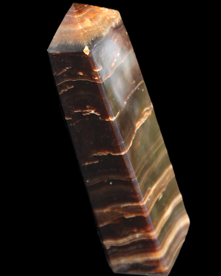 Chocolate Calcite obelisk 110*30*24mm 214g in sunlight - Rocks and Things Store