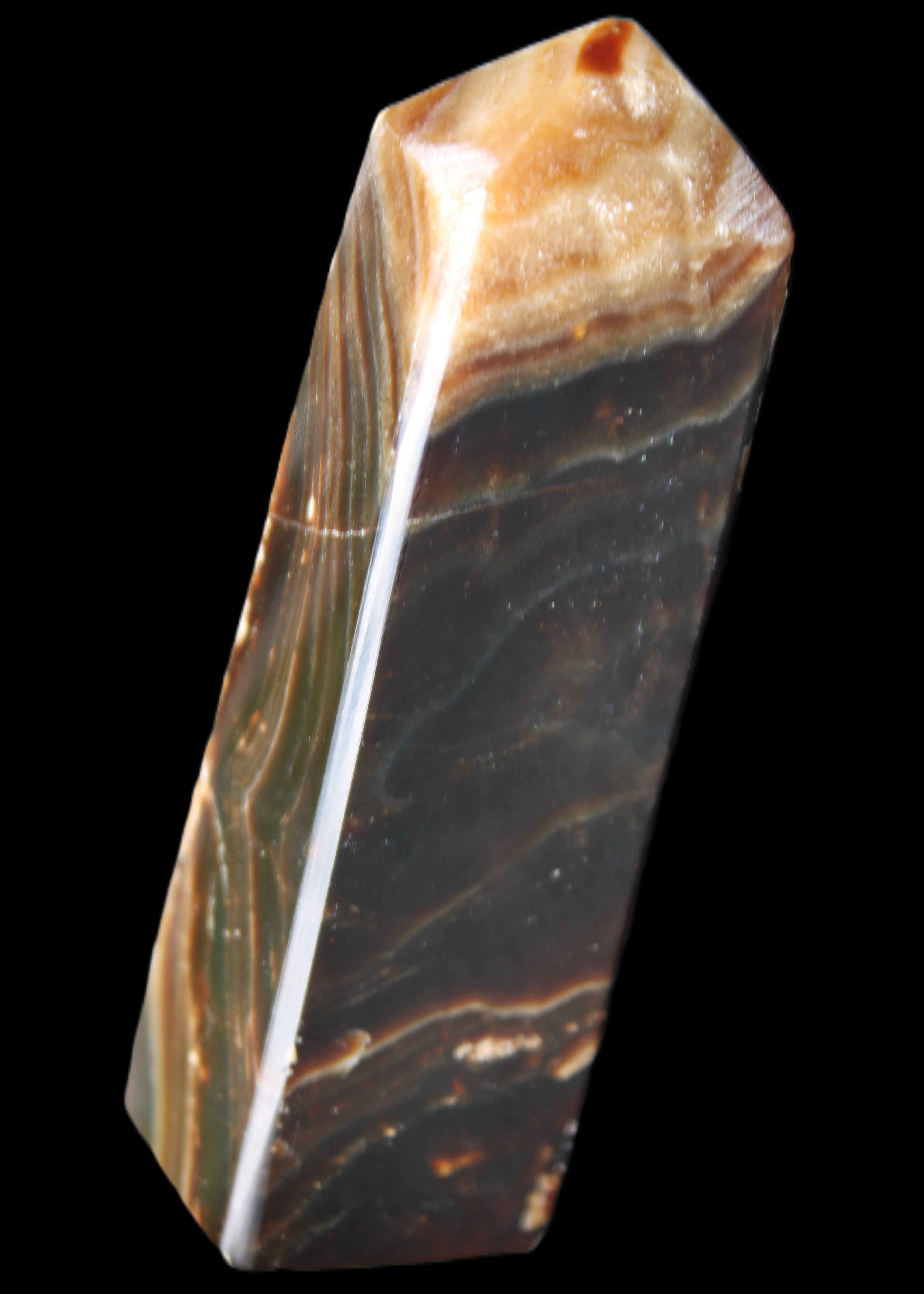 Chocolate Calcite obelisk 118*33*28mm 236g in sunlight - Rocks and Things Store