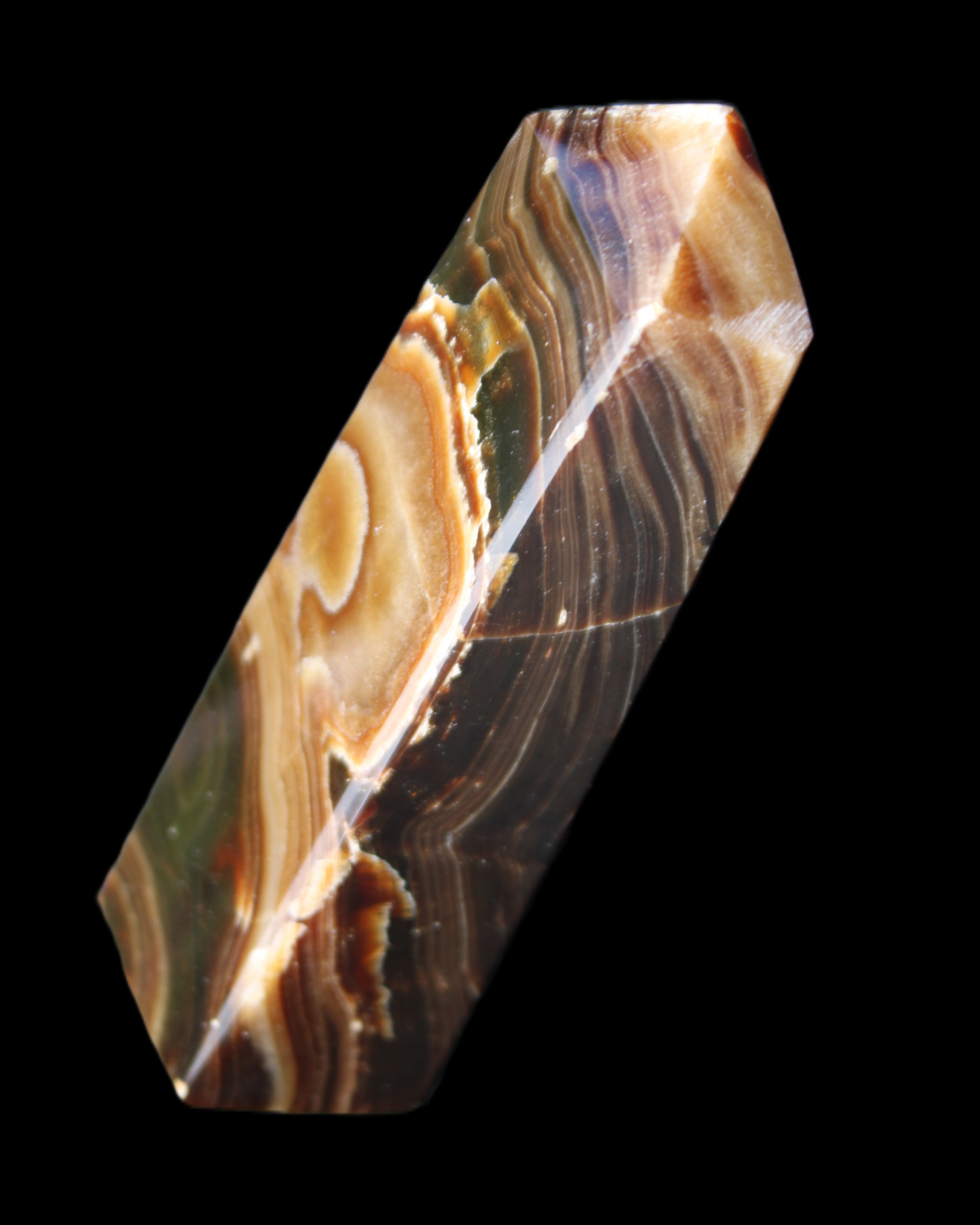 Chocolate Calcite obelisk 118*33*28mm 236g in sunlight - Rocks and Things Store