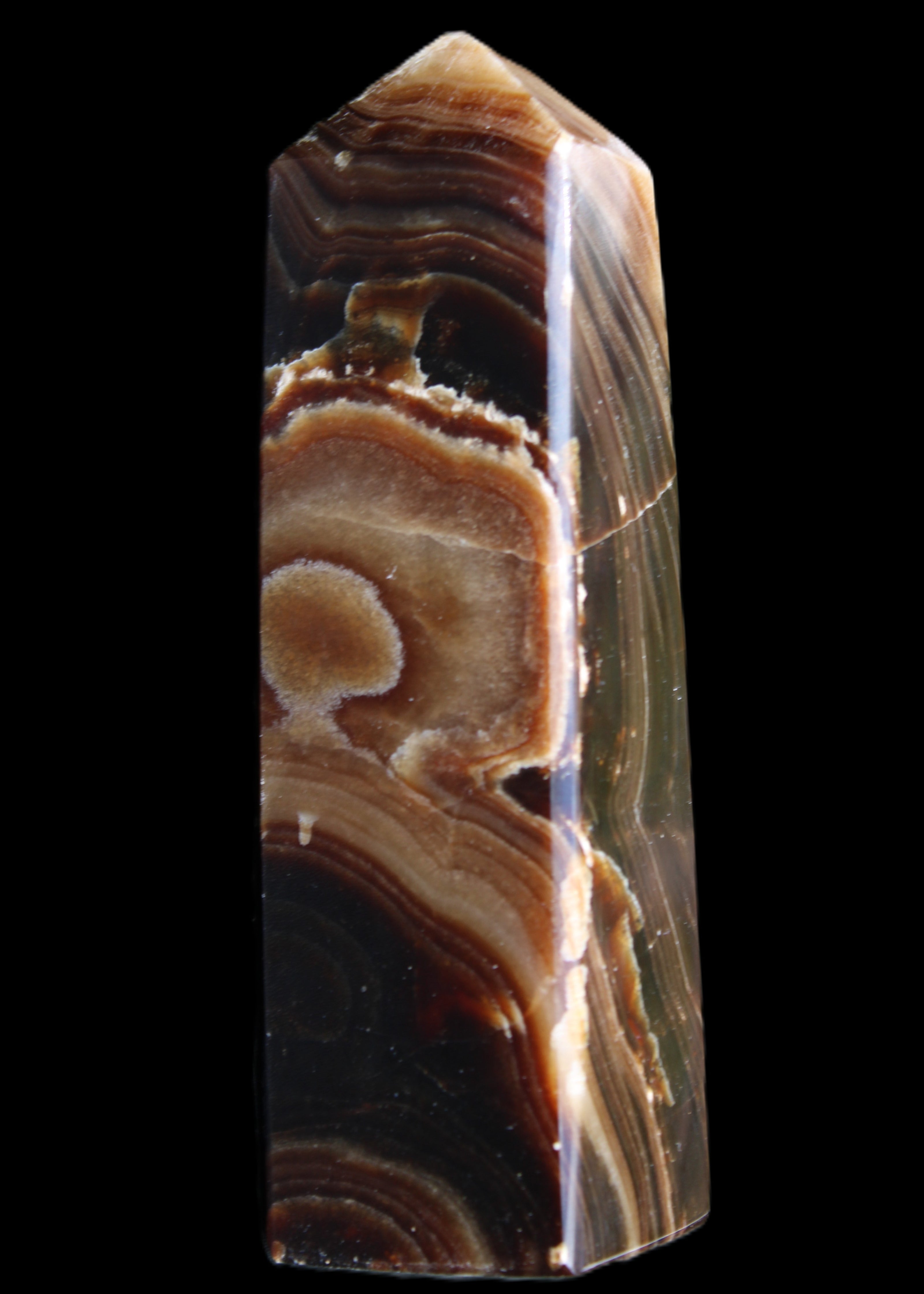 Chocolate Calcite obelisk 118*33*28mm 236g in sunlight - Rocks and Things Store