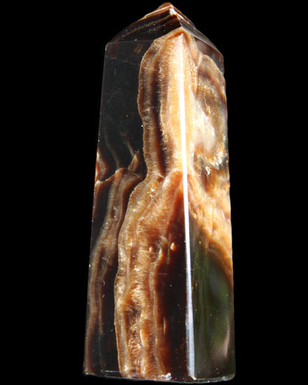 Chocolate Calcite obelisk 107*33*32mm 236g in sunlight - Rocks and Things Store