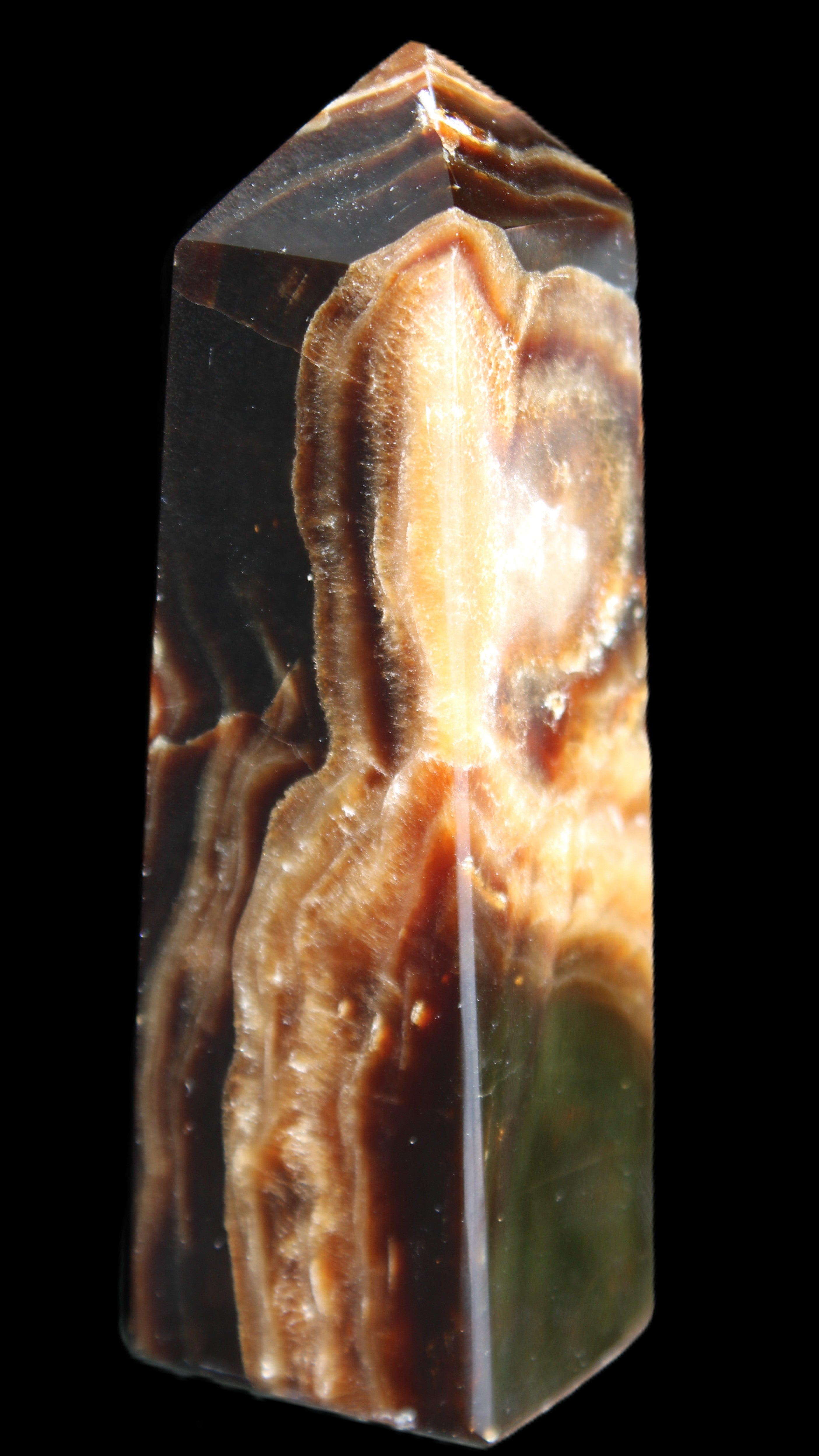 Chocolate Calcite obelisk 107*33*32mm 236g in sunlight - Rocks and Things Store
