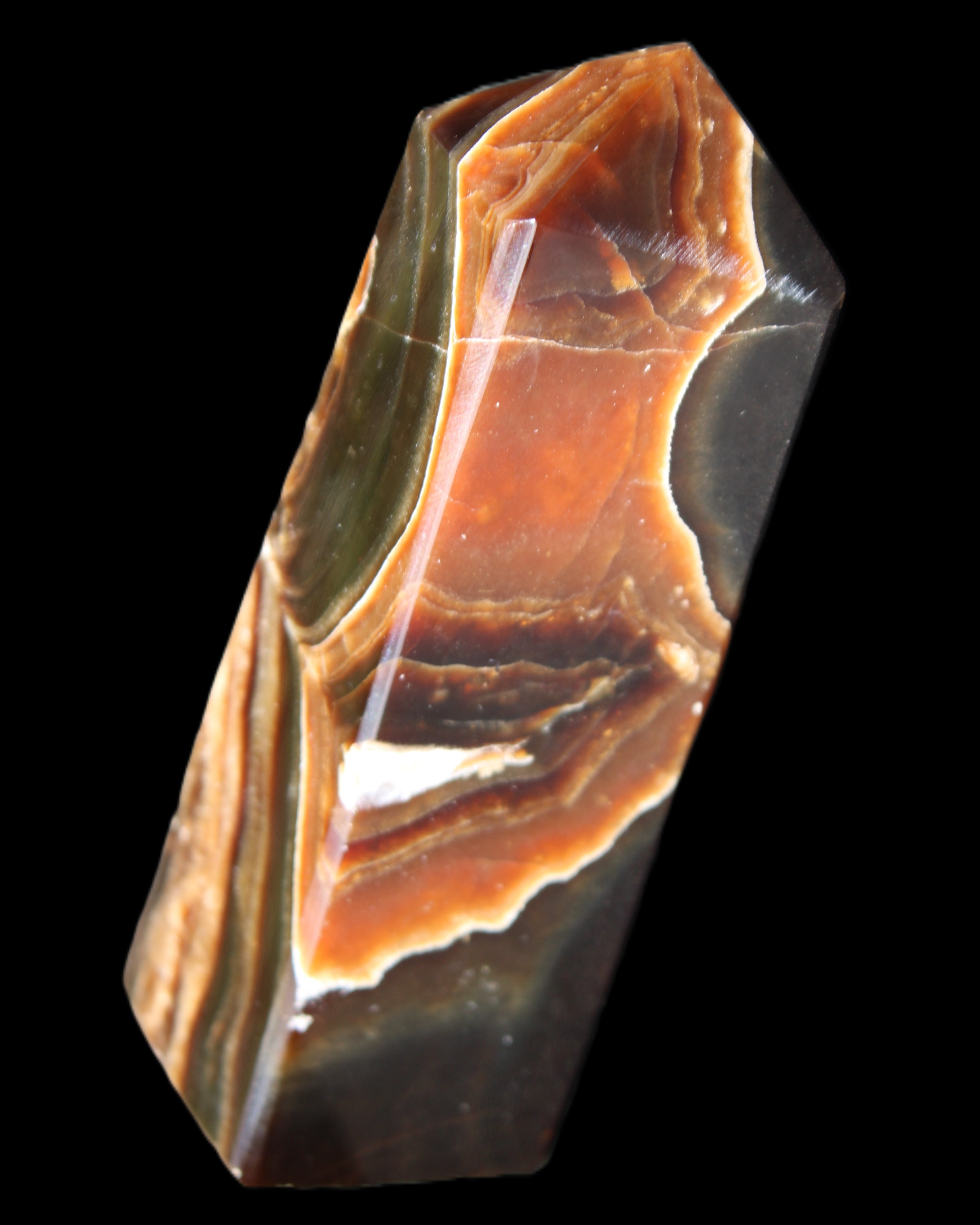 Chocolate Calcite obelisk 107*33*32mm 236g in sunlight - Rocks and Things Store