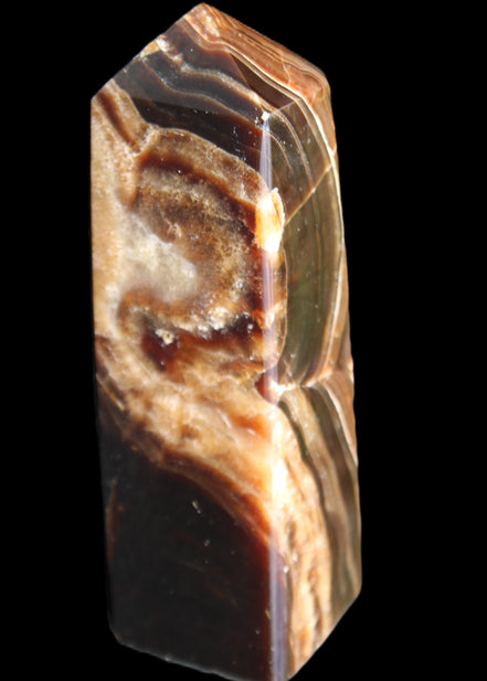 Chocolate Calcite obelisk 107*33*32mm 236g in sunlight - Rocks and Things Store