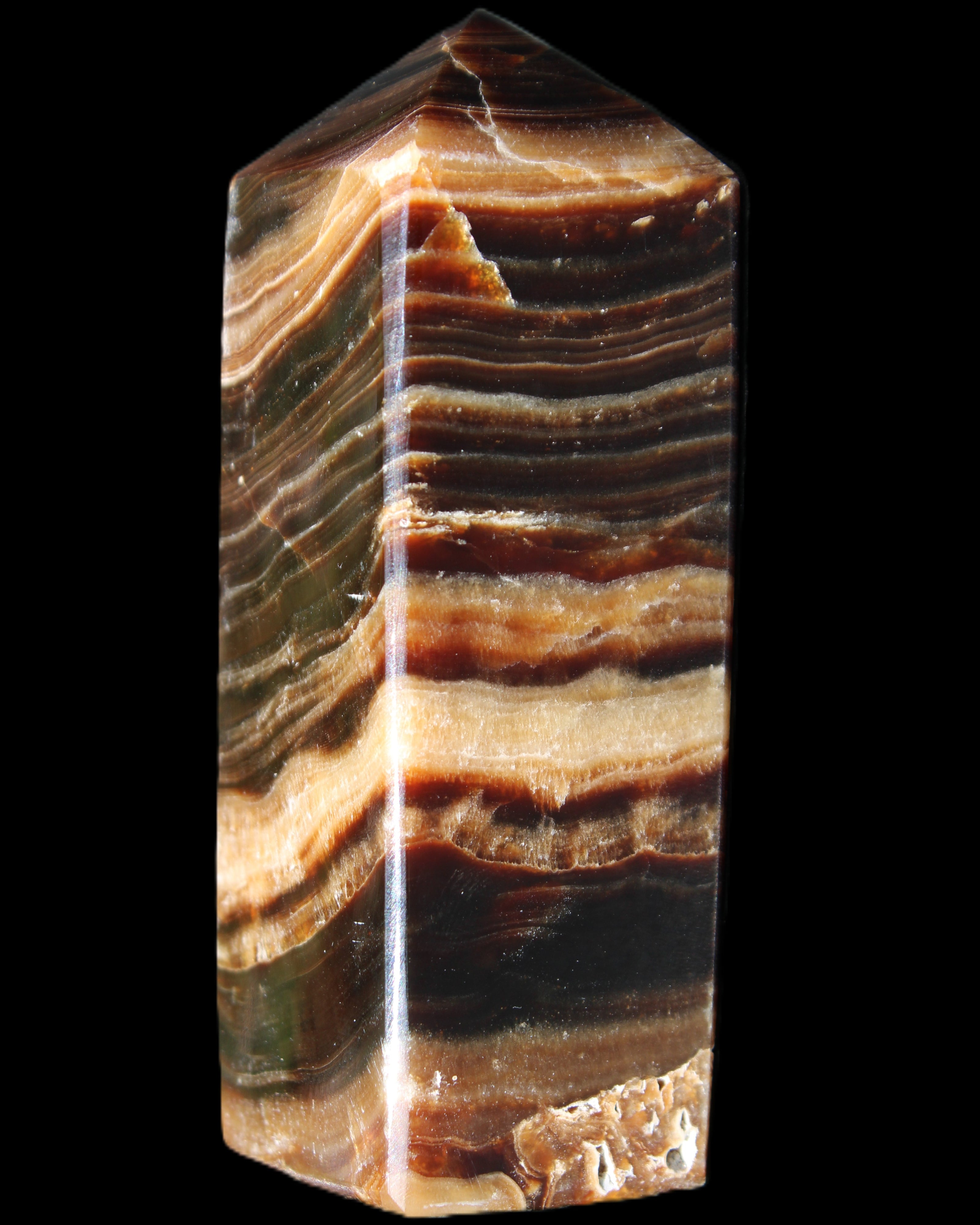 Chocolate Calcite obelisk 98*32*30mm 253g in sunlight - Rocks and Things Store