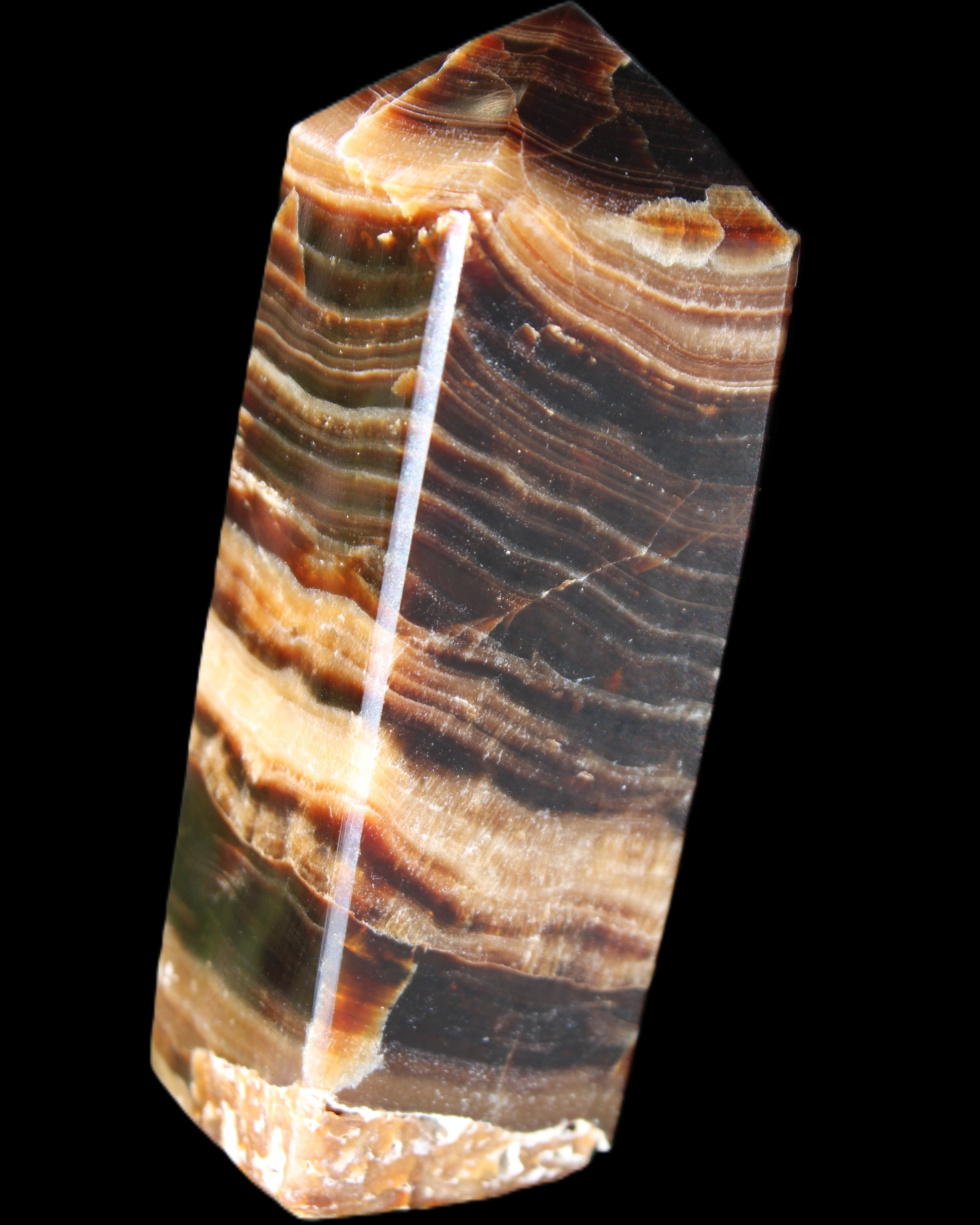 Chocolate Calcite obelisk 98*32*30mm 253g in sunlight - Rocks and Things Store