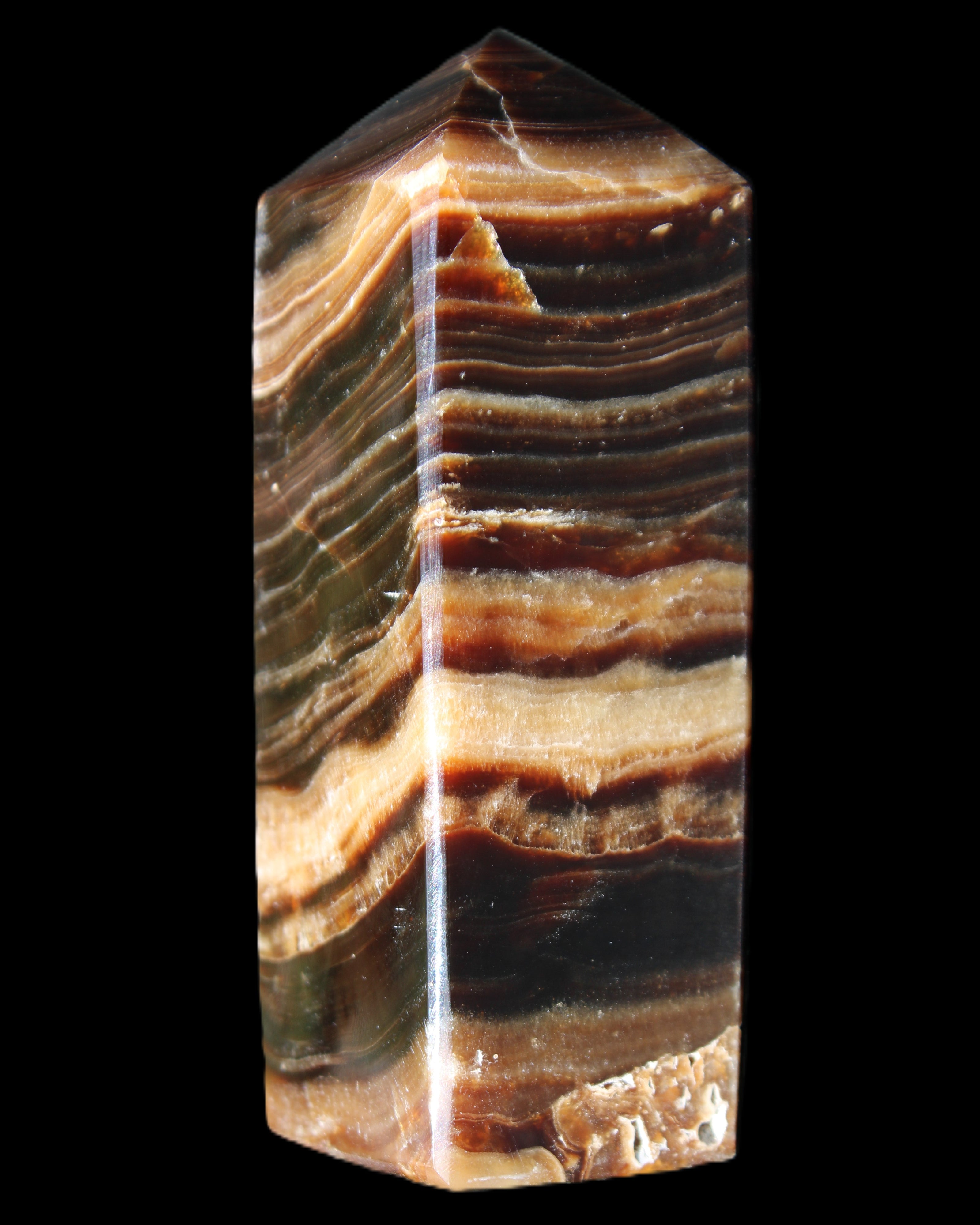 Chocolate Calcite obelisk 98*32*30mm 253g in sunlight - Rocks and Things Store