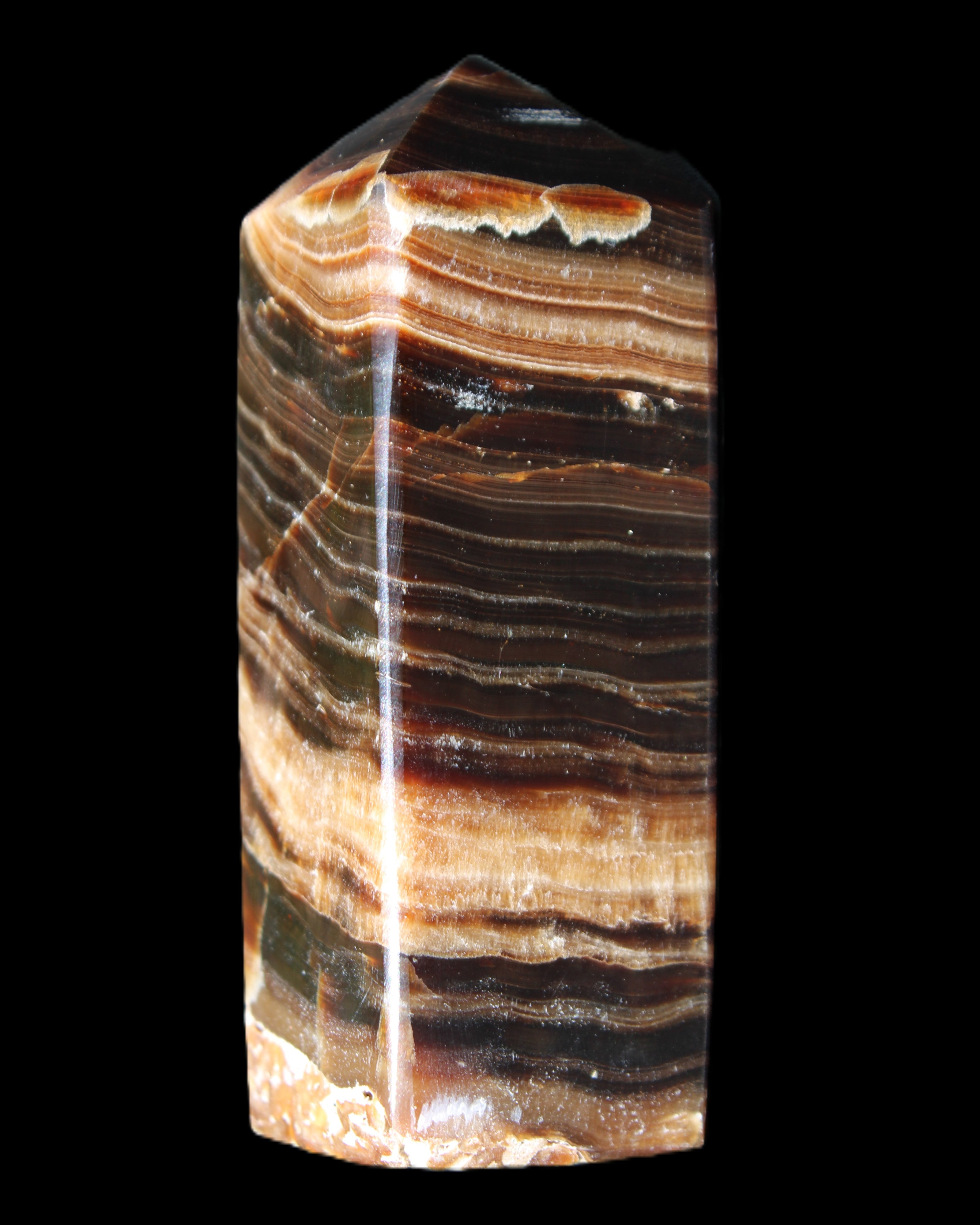 Chocolate Calcite obelisk 98*32*30mm 253g in sunlight - Rocks and Things Store