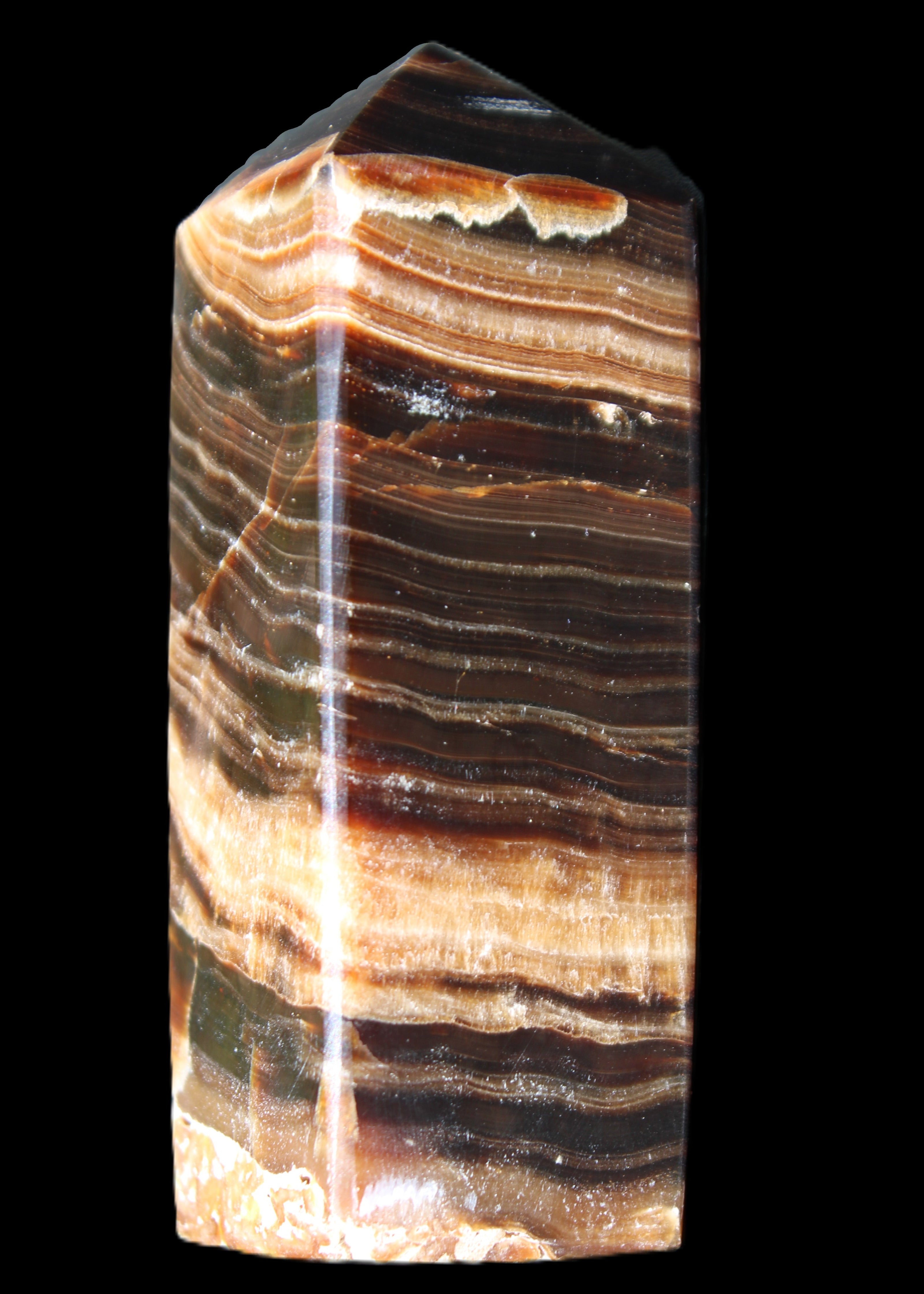 Chocolate Calcite obelisk 98*32*30mm 253g in sunlight - Rocks and Things Store