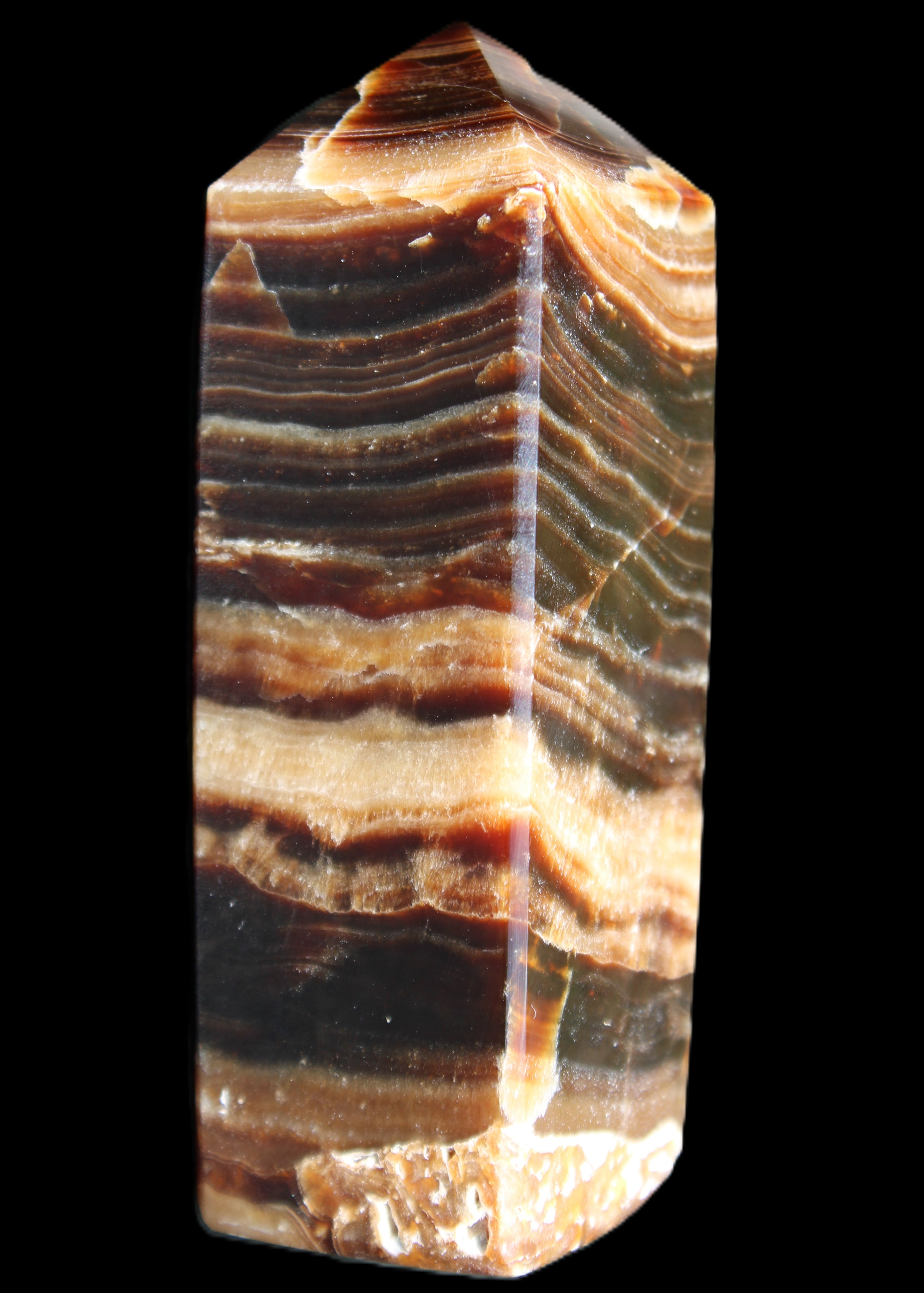 Chocolate Calcite obelisk 98*32*30mm 253g in sunlight - Rocks and Things Store