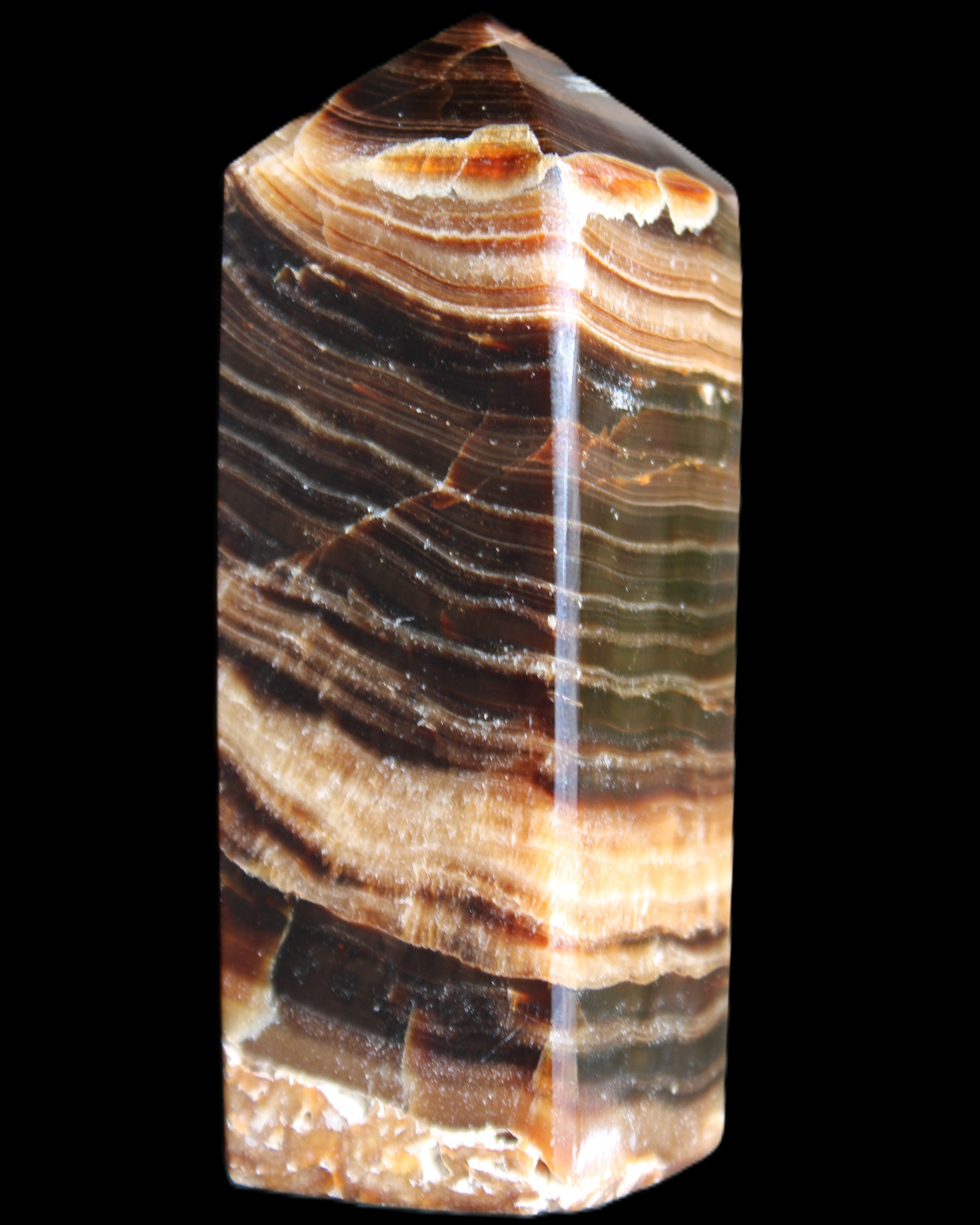 Chocolate Calcite obelisk 98*32*30mm 253g in sunlight - Rocks and Things Store