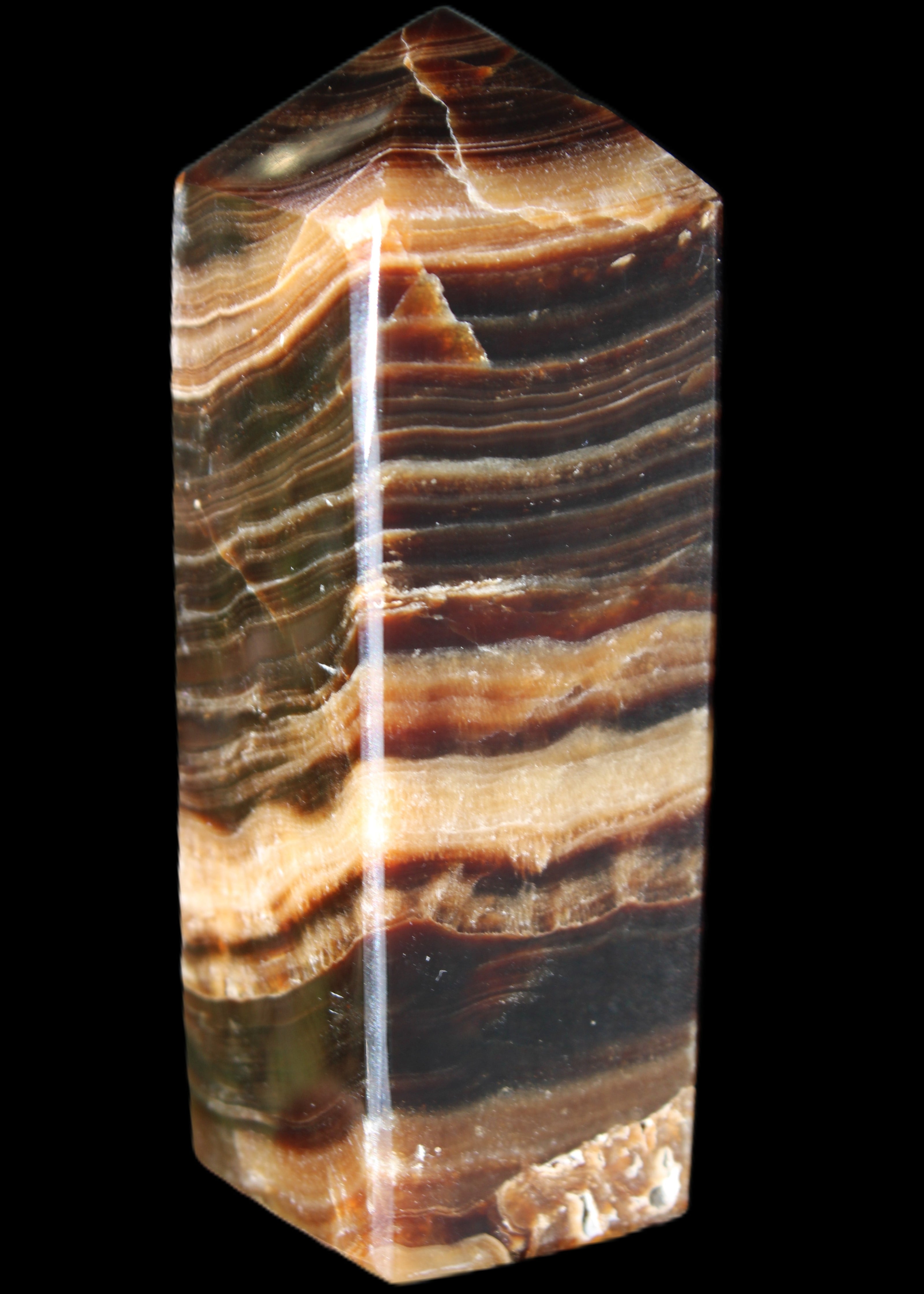 Chocolate Calcite obelisk 98*32*30mm 253g in sunlight - Rocks and Things Store