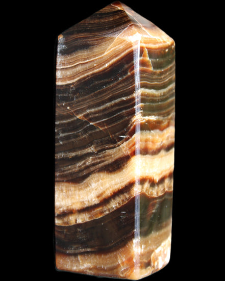 Chocolate Calcite obelisk 98*32*30mm 253g in sunlight - Rocks and Things Store