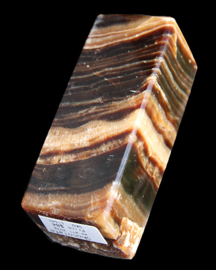 Chocolate Calcite obelisk 98*32*30mm 253g in sunlight - Rocks and Things Store