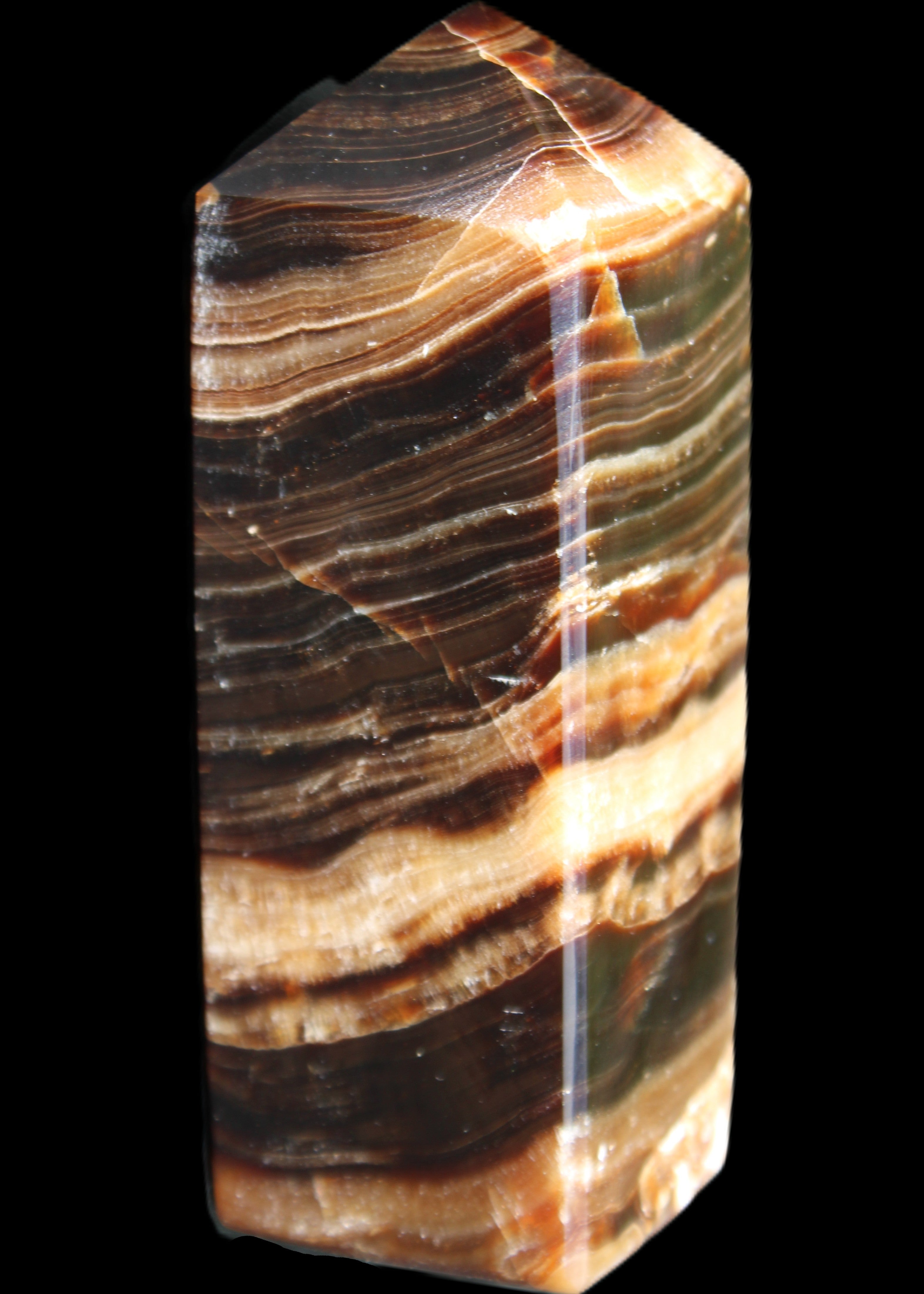 Chocolate Calcite obelisk 98*32*30mm 253g in sunlight - Rocks and Things Store