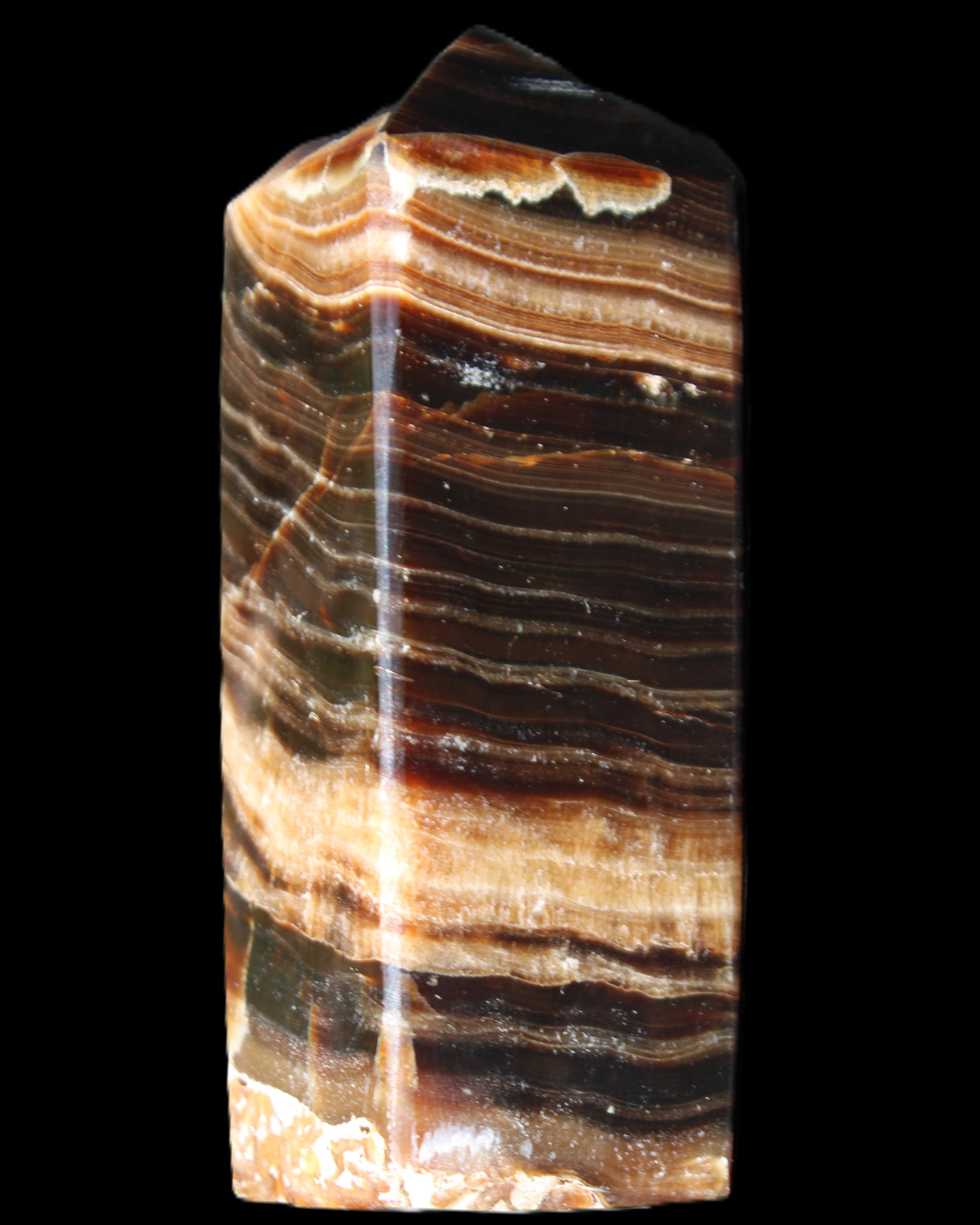 Chocolate Calcite obelisk 98*32*30mm 253g in sunlight - Rocks and Things Store