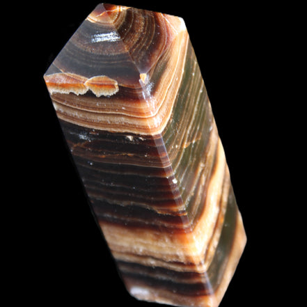 Chocolate Calcite obelisk 98*32*30mm 253g in sunlight - Rocks and Things Store