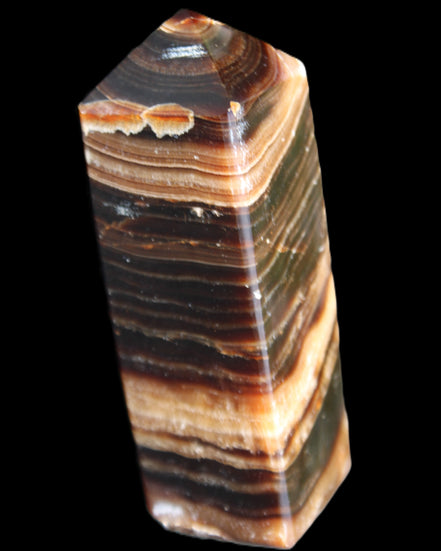 Chocolate Calcite obelisk 98*32*30mm 253g in sunlight - Rocks and Things Store