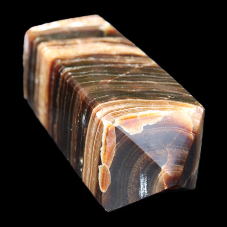 Chocolate Calcite obelisk 98*32*30mm 253g in sunlight - Rocks and Things Store