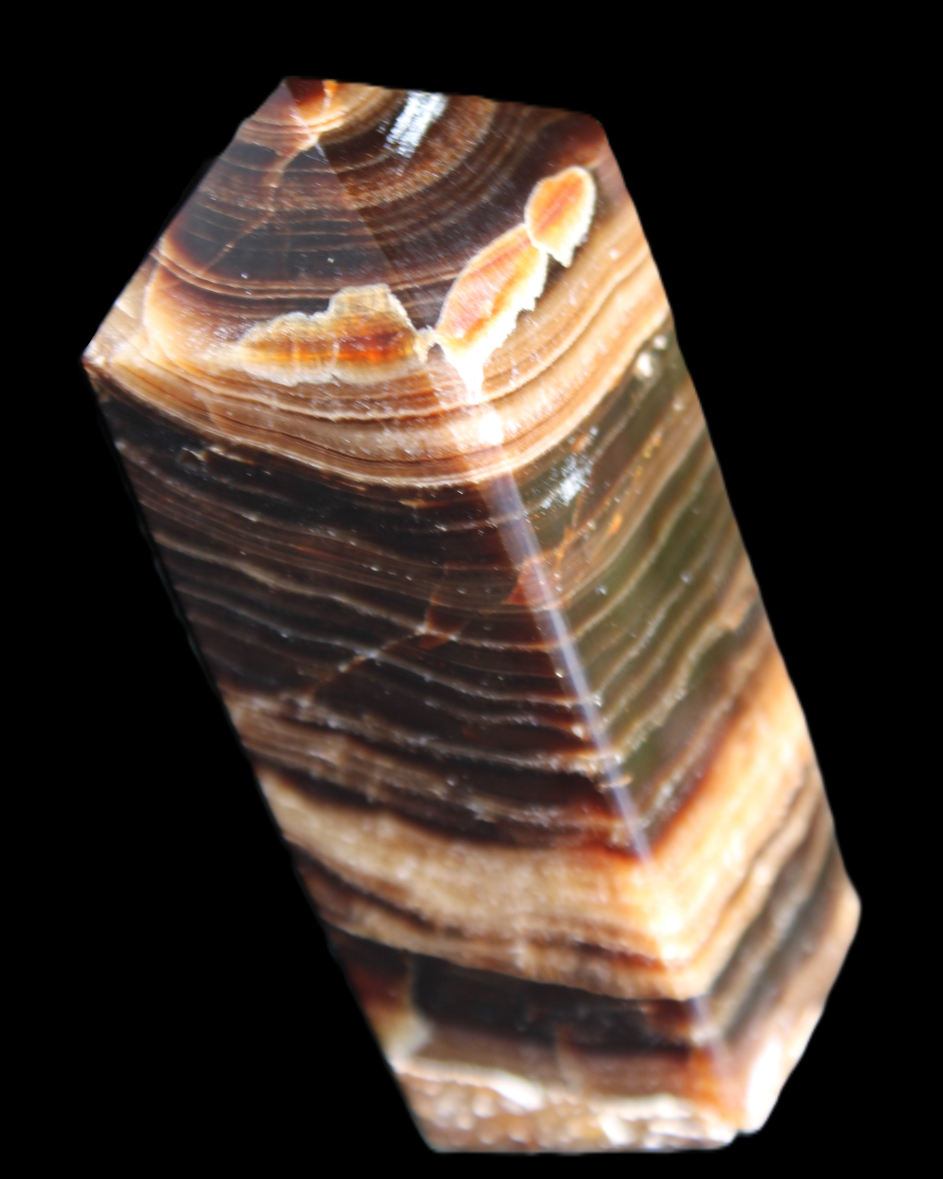 Chocolate Calcite obelisk 98*32*30mm 253g in sunlight - Rocks and Things Store