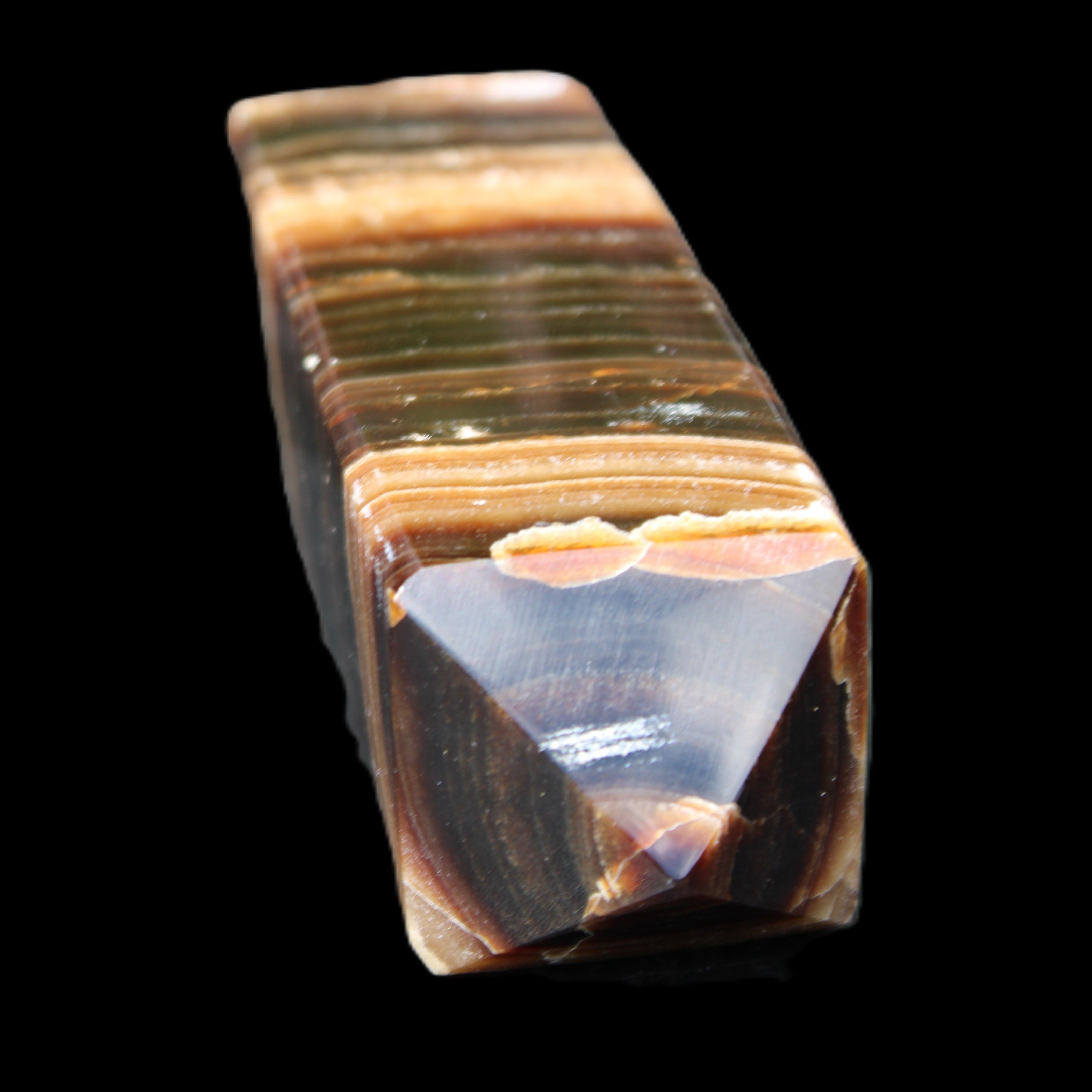 Chocolate Calcite obelisk 98*32*30mm 253g in sunlight - Rocks and Things Store