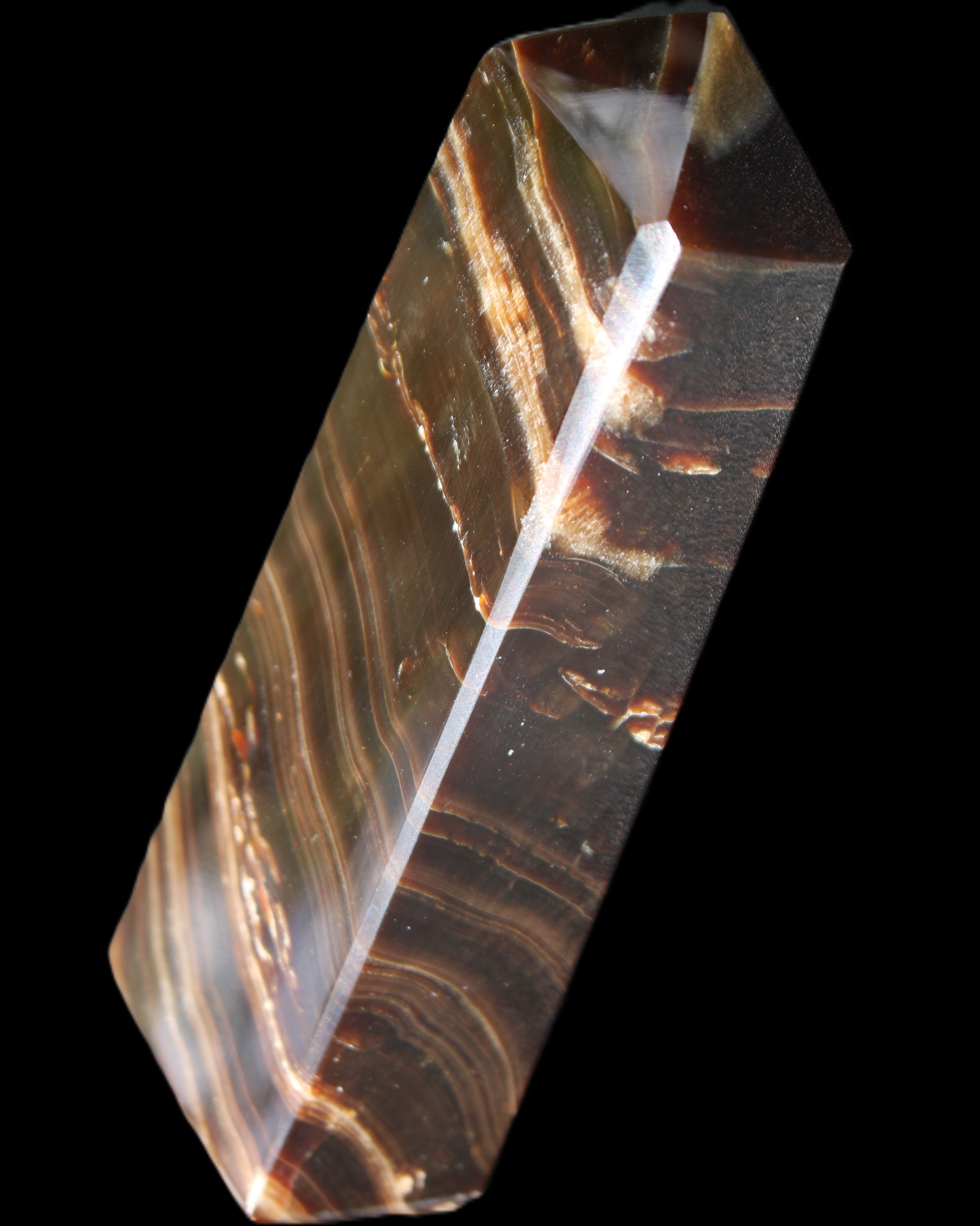 Chocolate Calcite obelisk 107*33*23mm 197.5g in sunlight - Rocks and Things Store