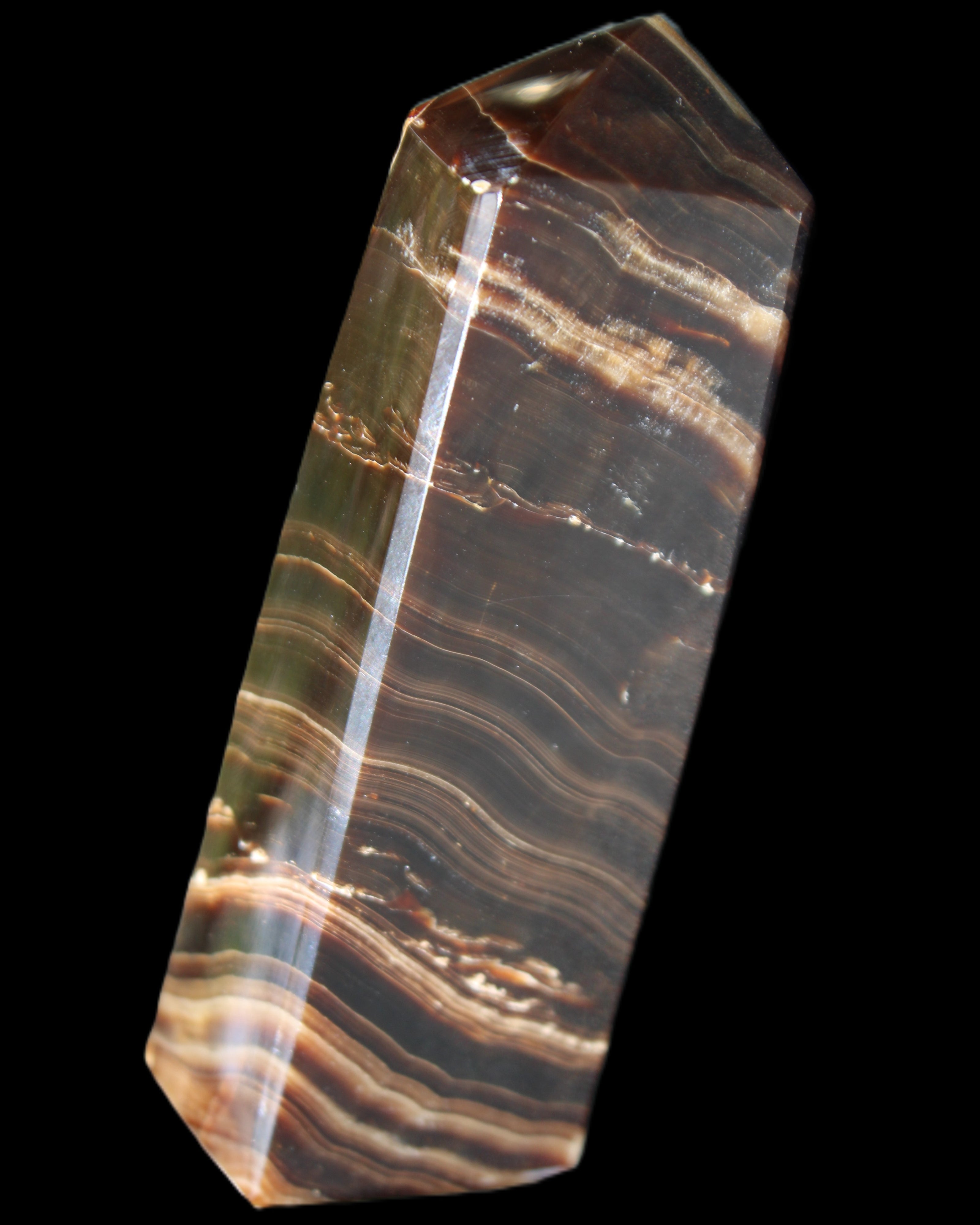 Chocolate Calcite obelisk 107*33*23mm 197.5g in sunlight - Rocks and Things Store
