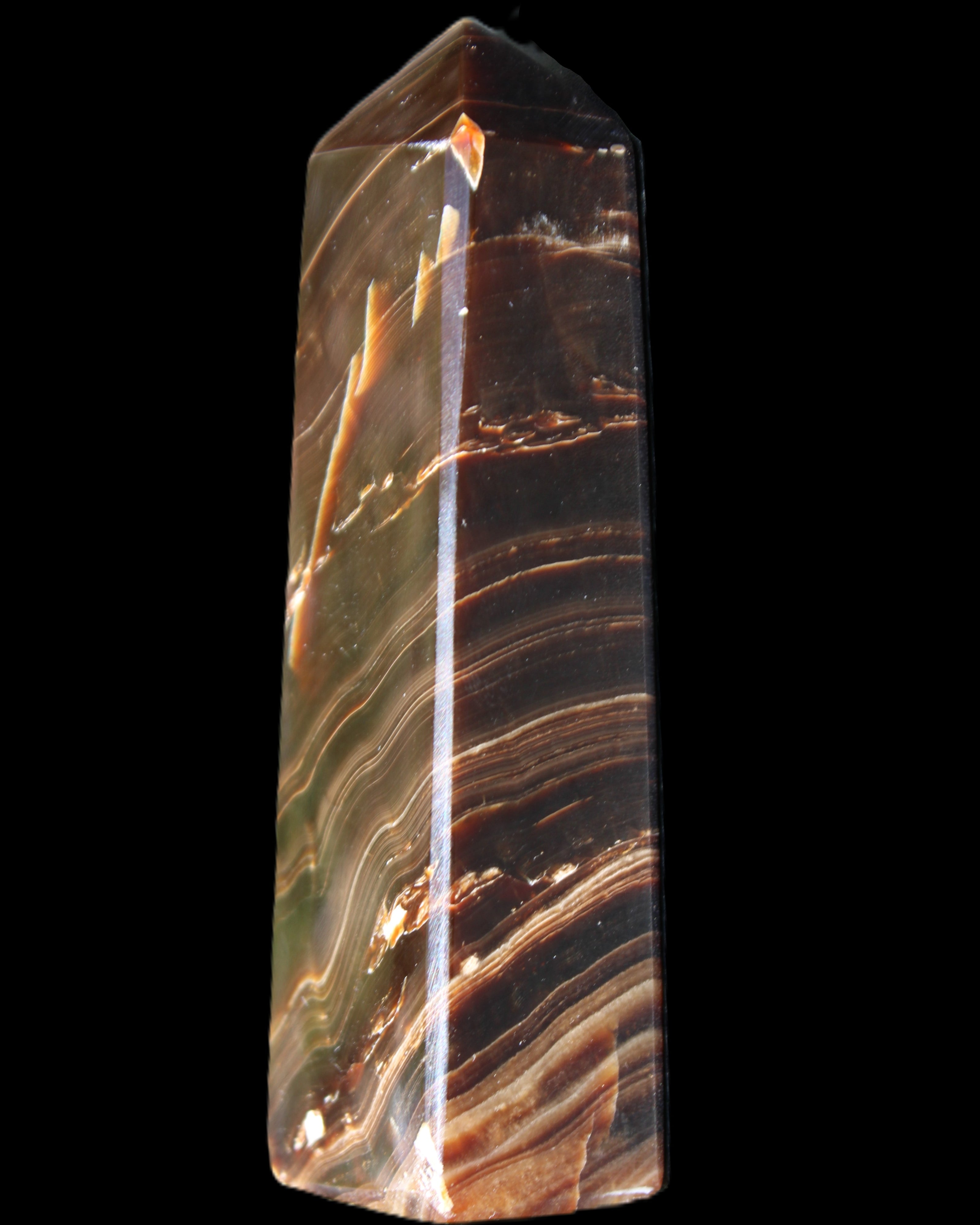 Chocolate Calcite obelisk 107*33*23mm 197.5g in sunlight - Rocks and Things Store
