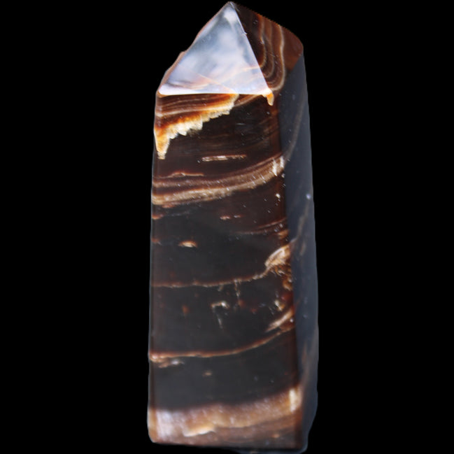 Chocolate Calcite obelisk 94*32*31mm 218g in sunlight - Rocks and Things Store