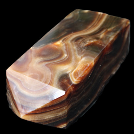 Chocolate Calcite obelisk 84*33*28mm 175g in sunlight - Rocks and Things Store