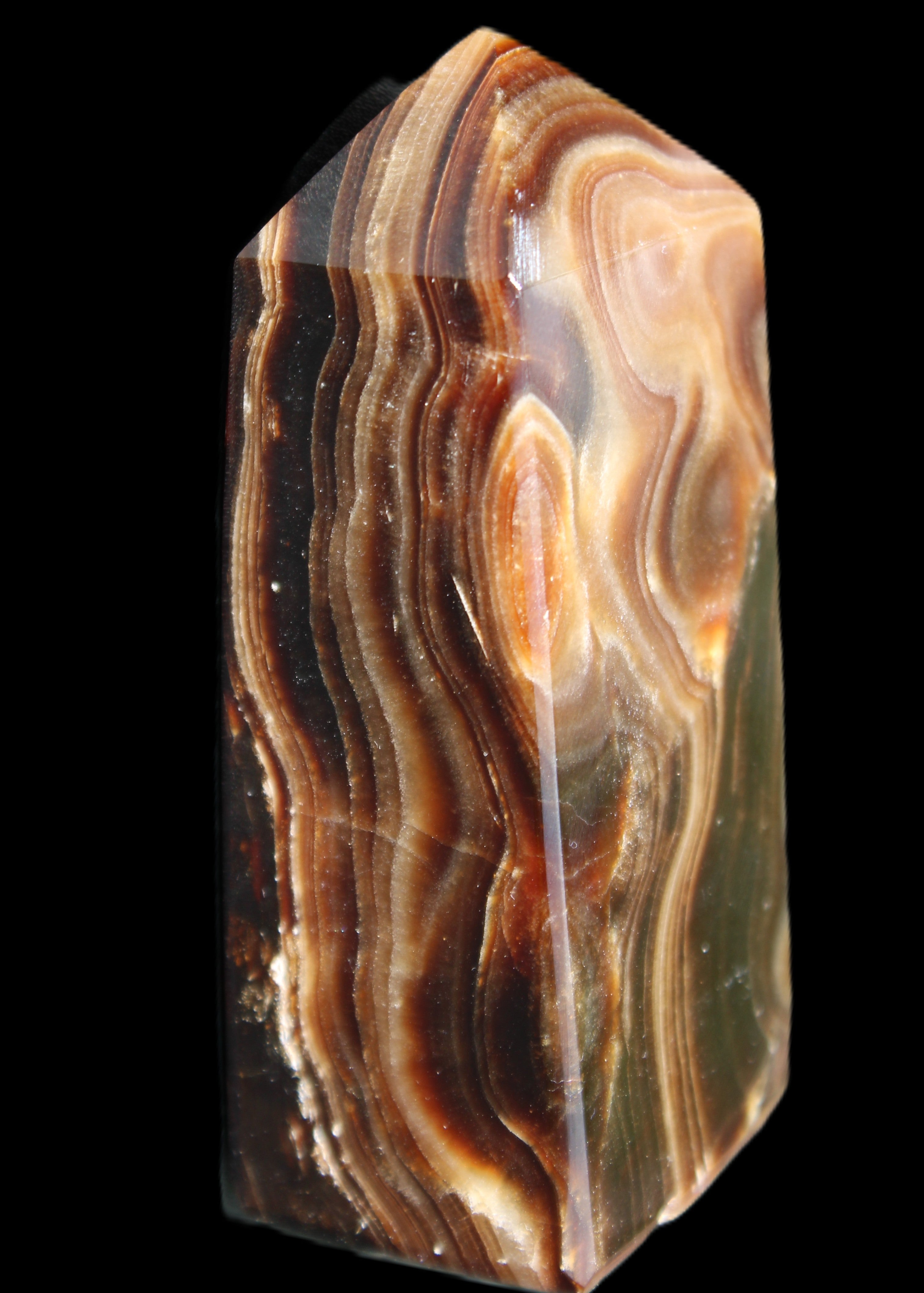 Chocolate Calcite obelisk 84*33*28mm 175g in sunlight - Rocks and Things Store