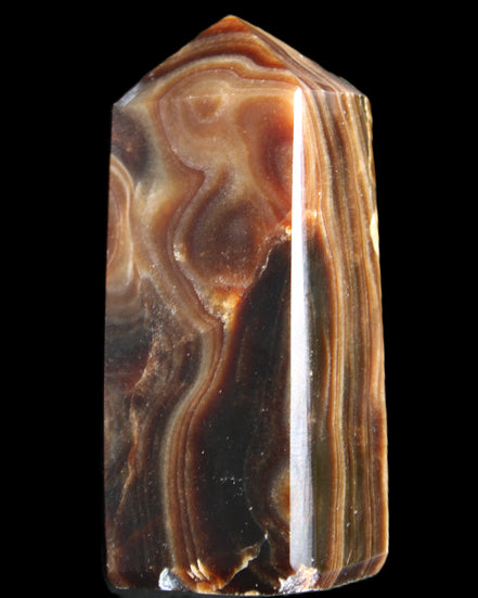 Chocolate Calcite obelisk 84*33*28mm 175g in sunlight - Rocks and Things Store