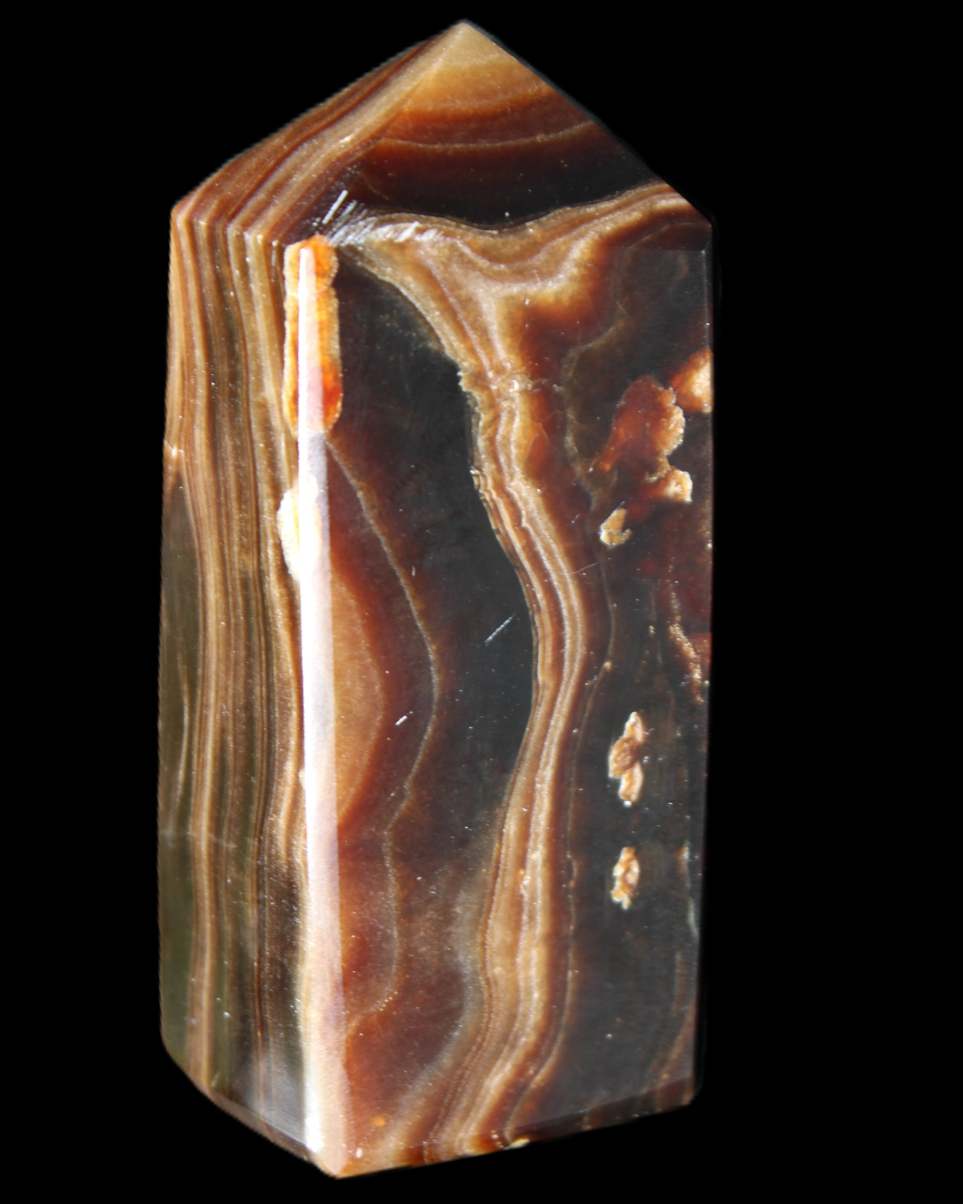 Chocolate Calcite obelisk 84*33*28mm 175g in sunlight - Rocks and Things Store