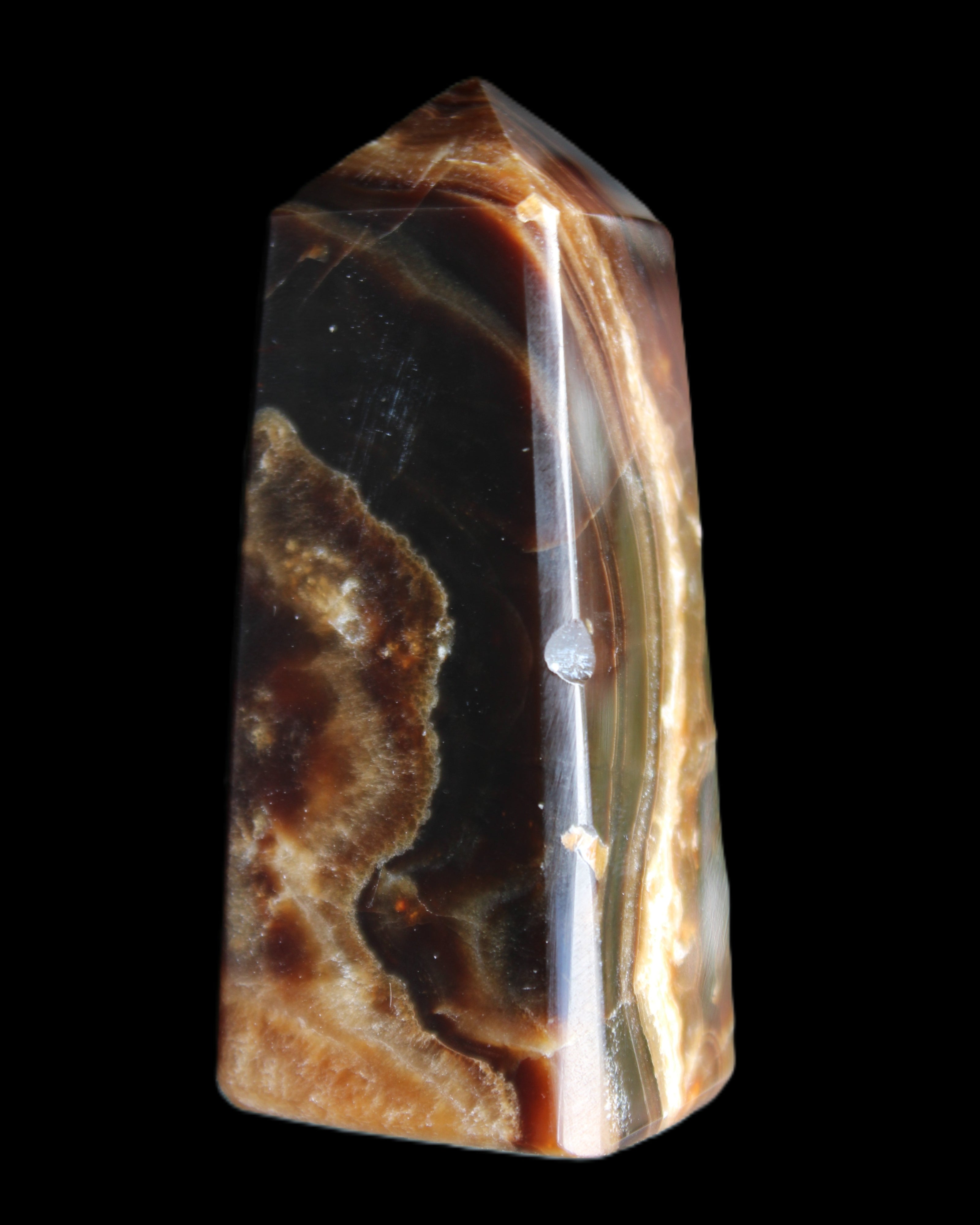 Chocolate Calcite obelisk 78*31*28mm 145g in sunlight - Rocks and Things Store