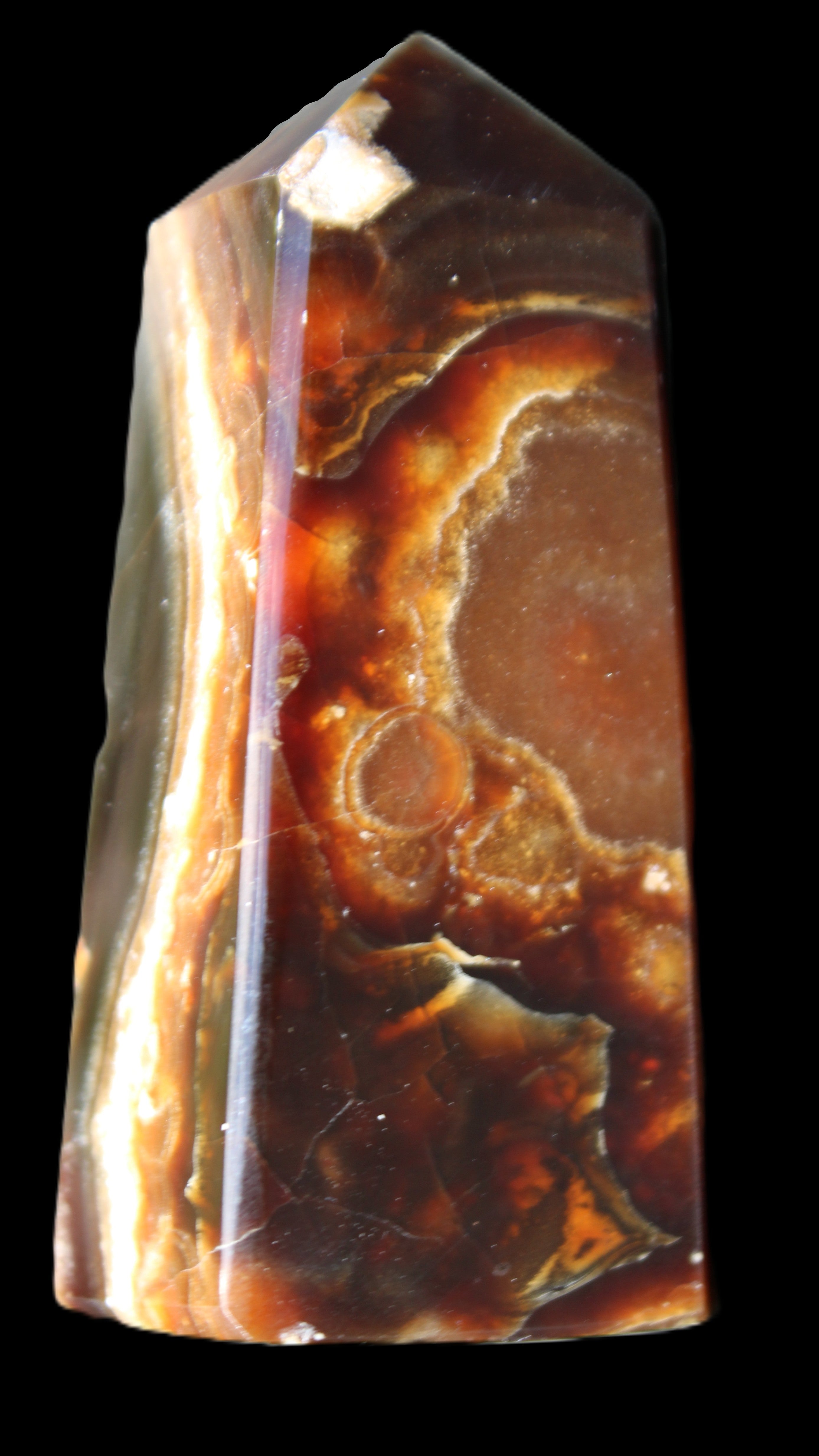 Chocolate Calcite obelisk 78*31*28mm 145g in sunlight - Rocks and Things Store