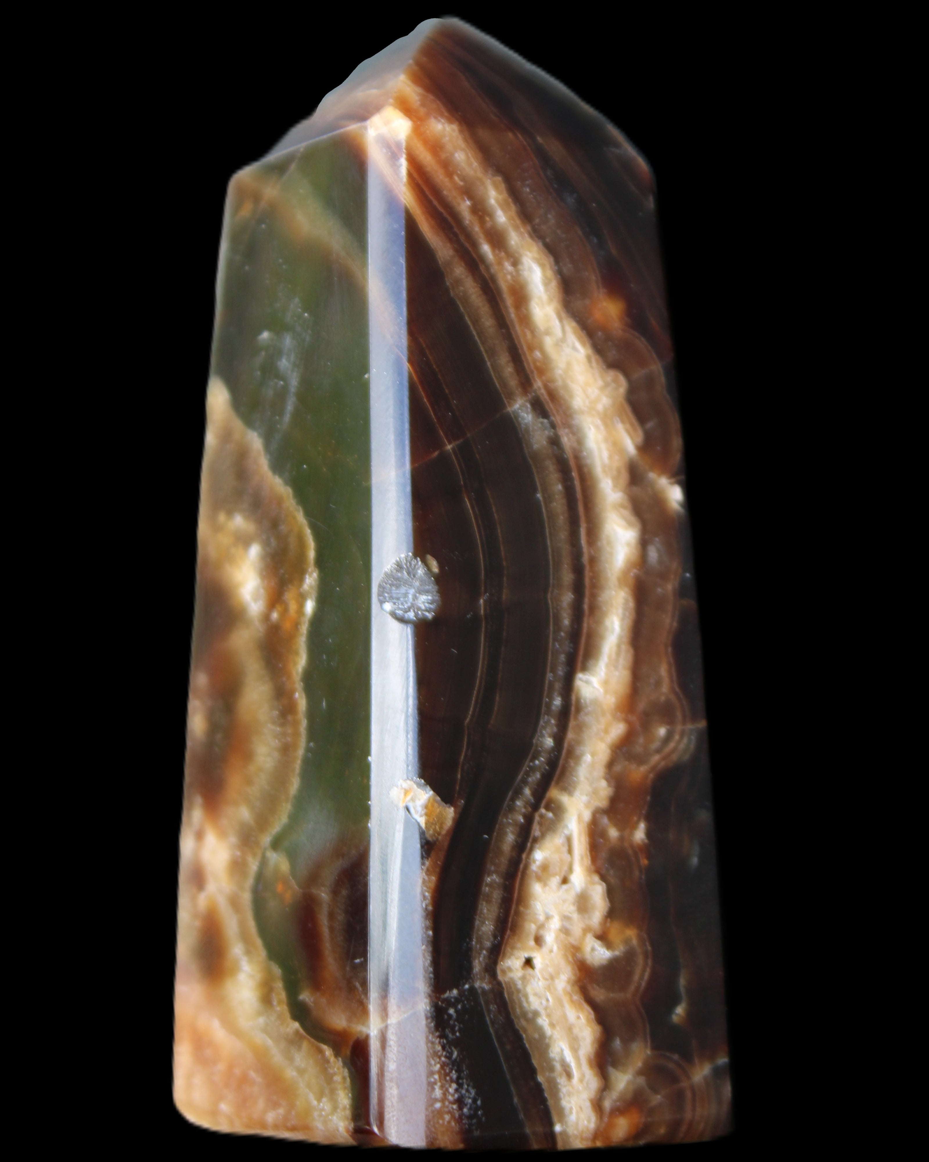 Chocolate Calcite obelisk 78*31*28mm 145g in sunlight - Rocks and Things Store